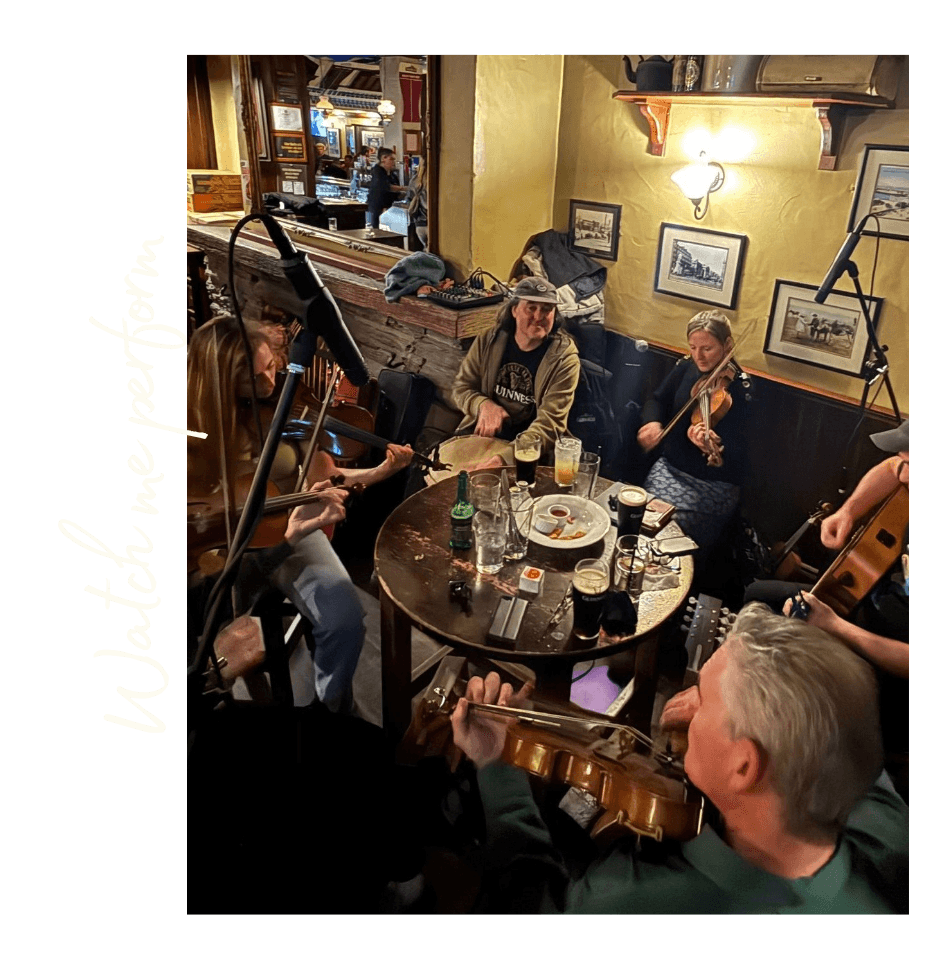 Erica and other musicians performing live at a traditional music session at a local Queenstown pub.