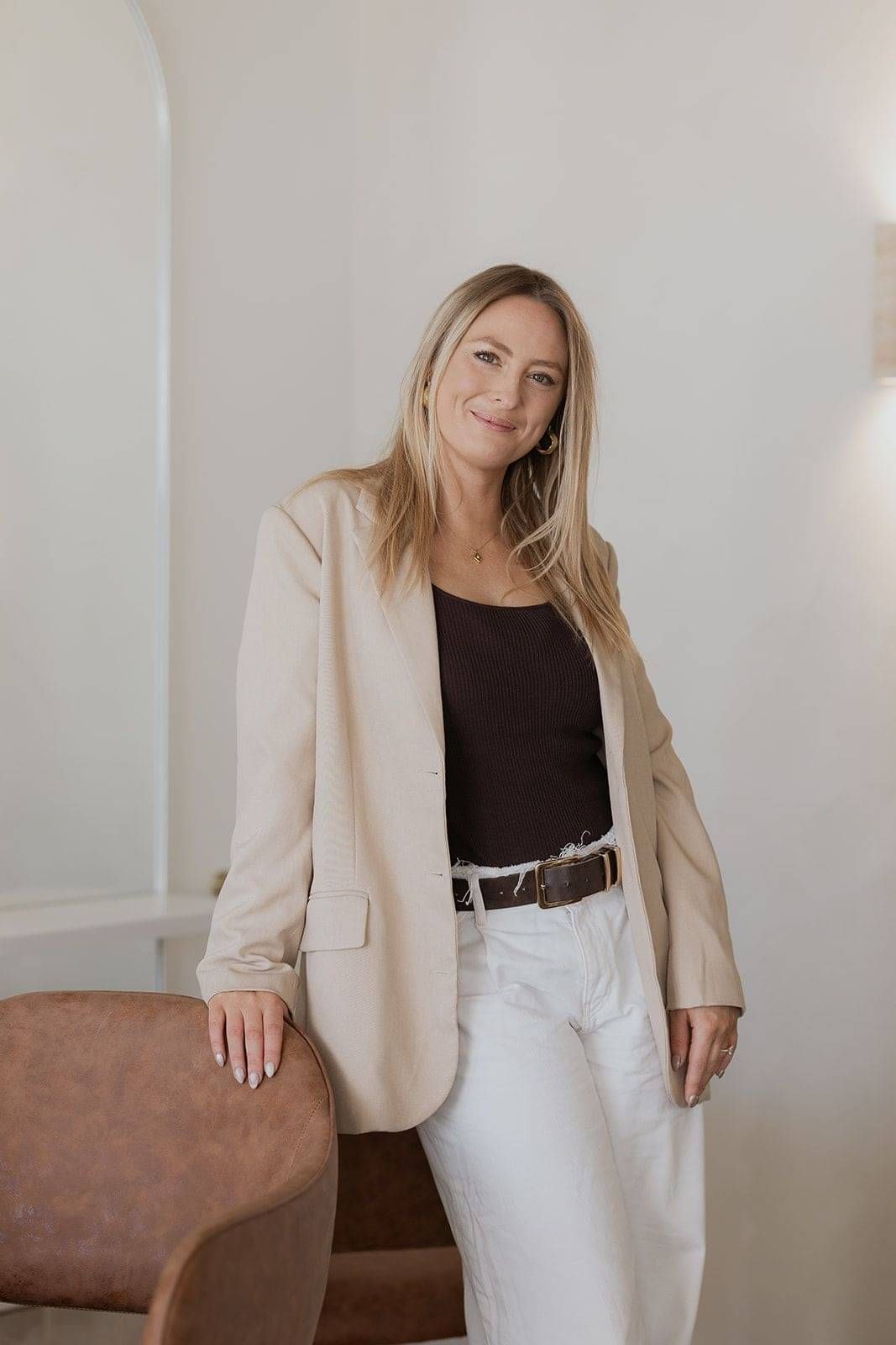 A photographic portrait of Haley - owner and hairstylist behind Wild Daisy Hair in Queenstown.