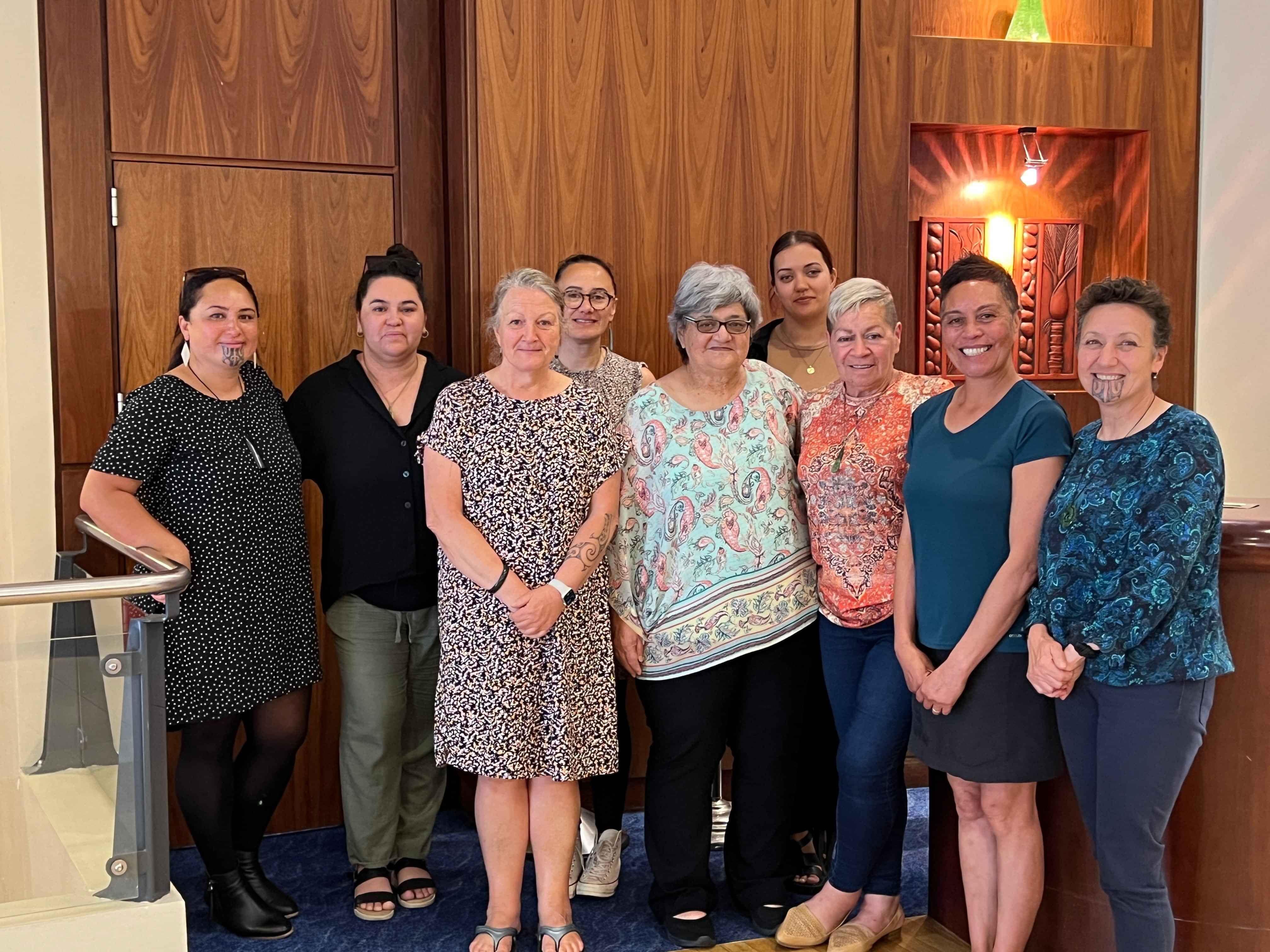 Group of participants standing in a workshop facilitated by AraHina for Foodstuffs’ Te Uru Kahikatea Māori Network.