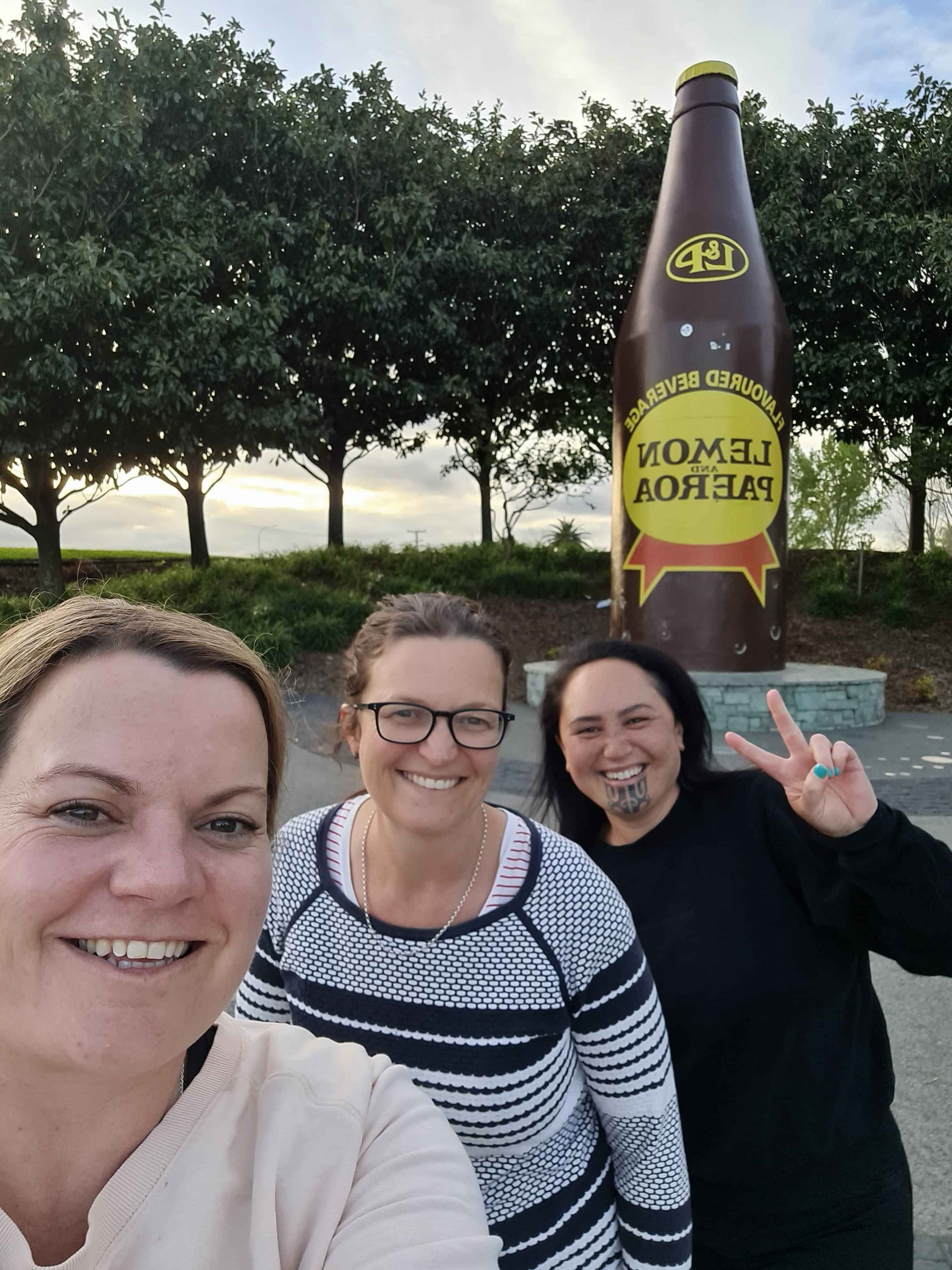 Group of participants standing in a workshop facilitated by AraHina for Foodstuffs’ Te Uru Kahikatea Māori Network.