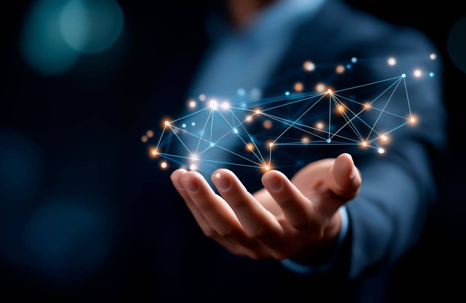 Hand holding digital network of nodes and lines, symbolizing advanced IT services and strategic technology planning.