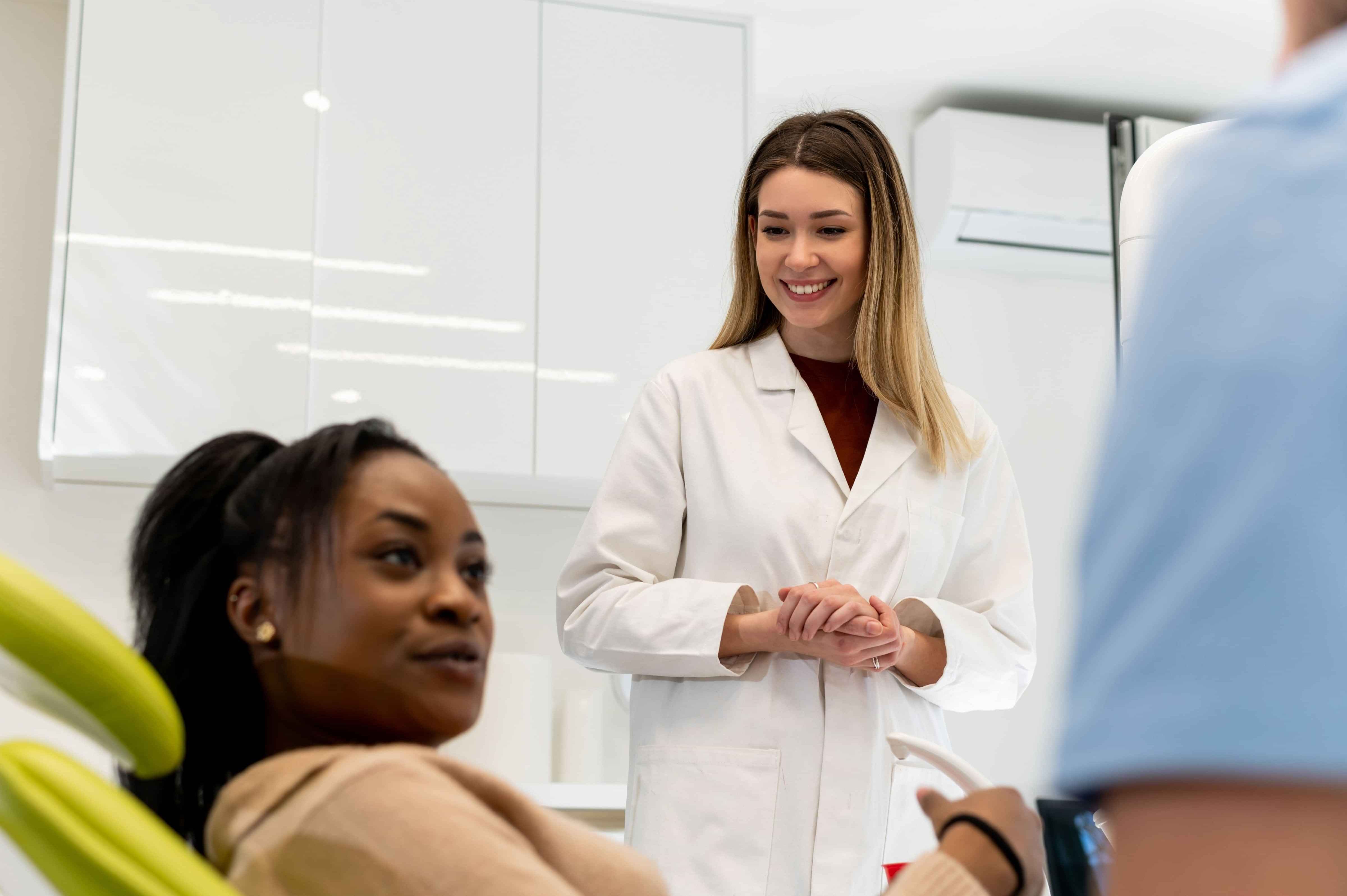 A clinician and patient talking about treatments in a consultation