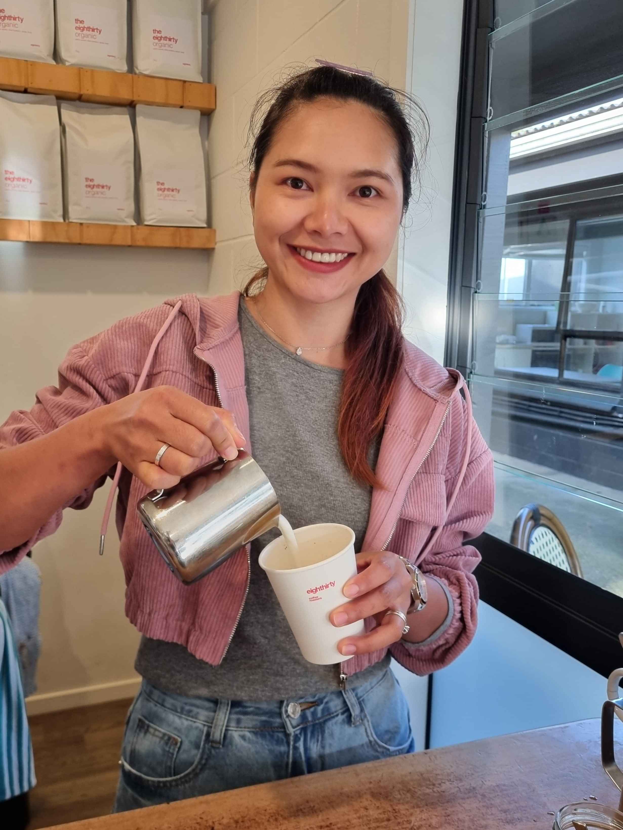 This is Ying, the face full of smiles making coffee and enjoying the island life.