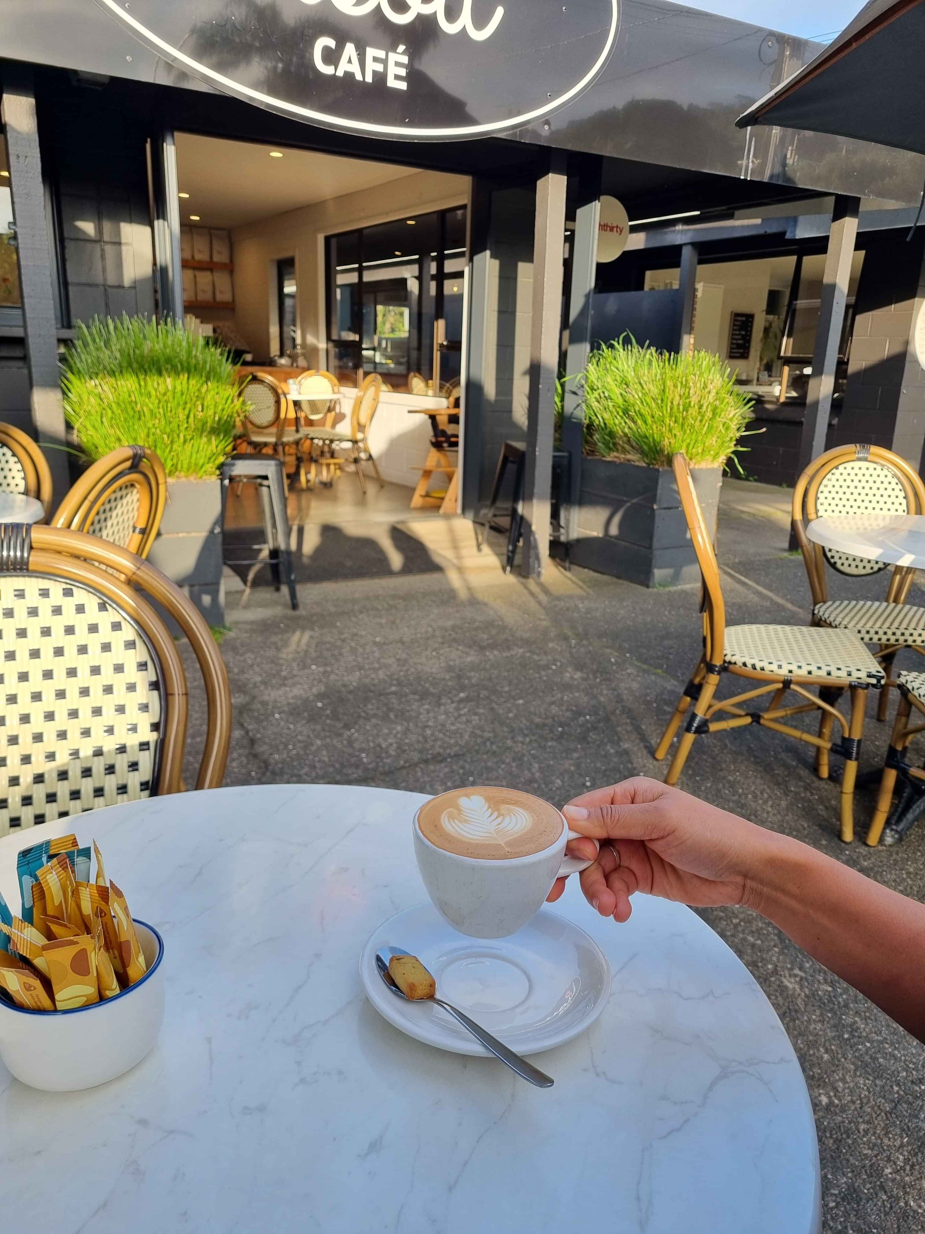 sitting in the sun drinking an Eighthirty coffee.