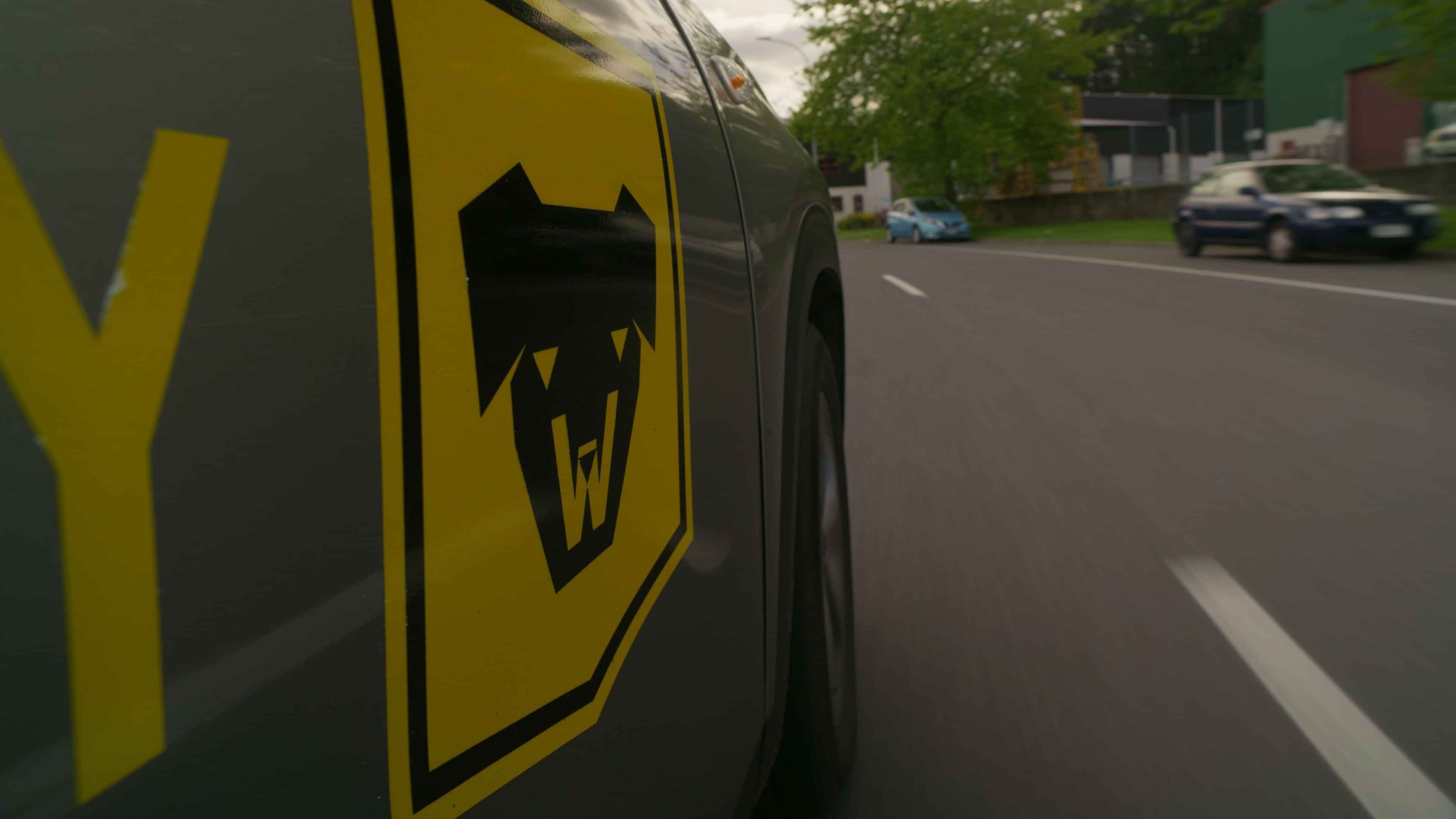 Close up of the Watchdog emblem on a security car