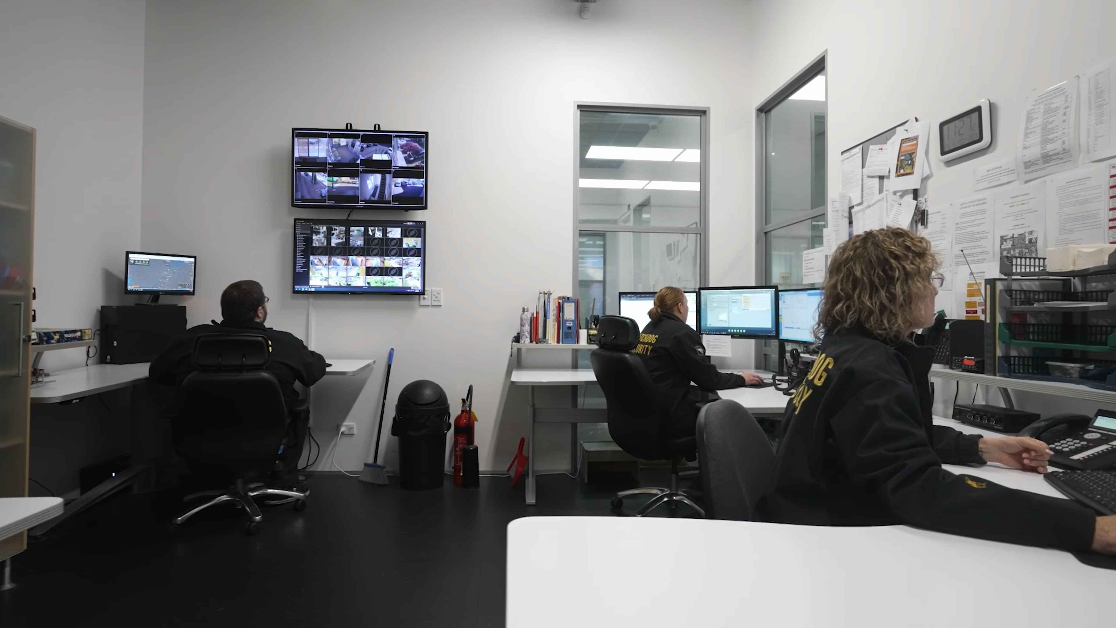 Watchdog workers monitoring CCTV footage