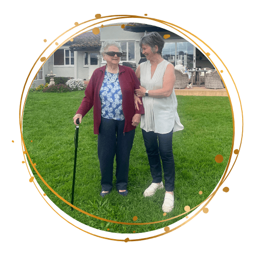 Caregiver and elderly person at home doing health check-in togethe