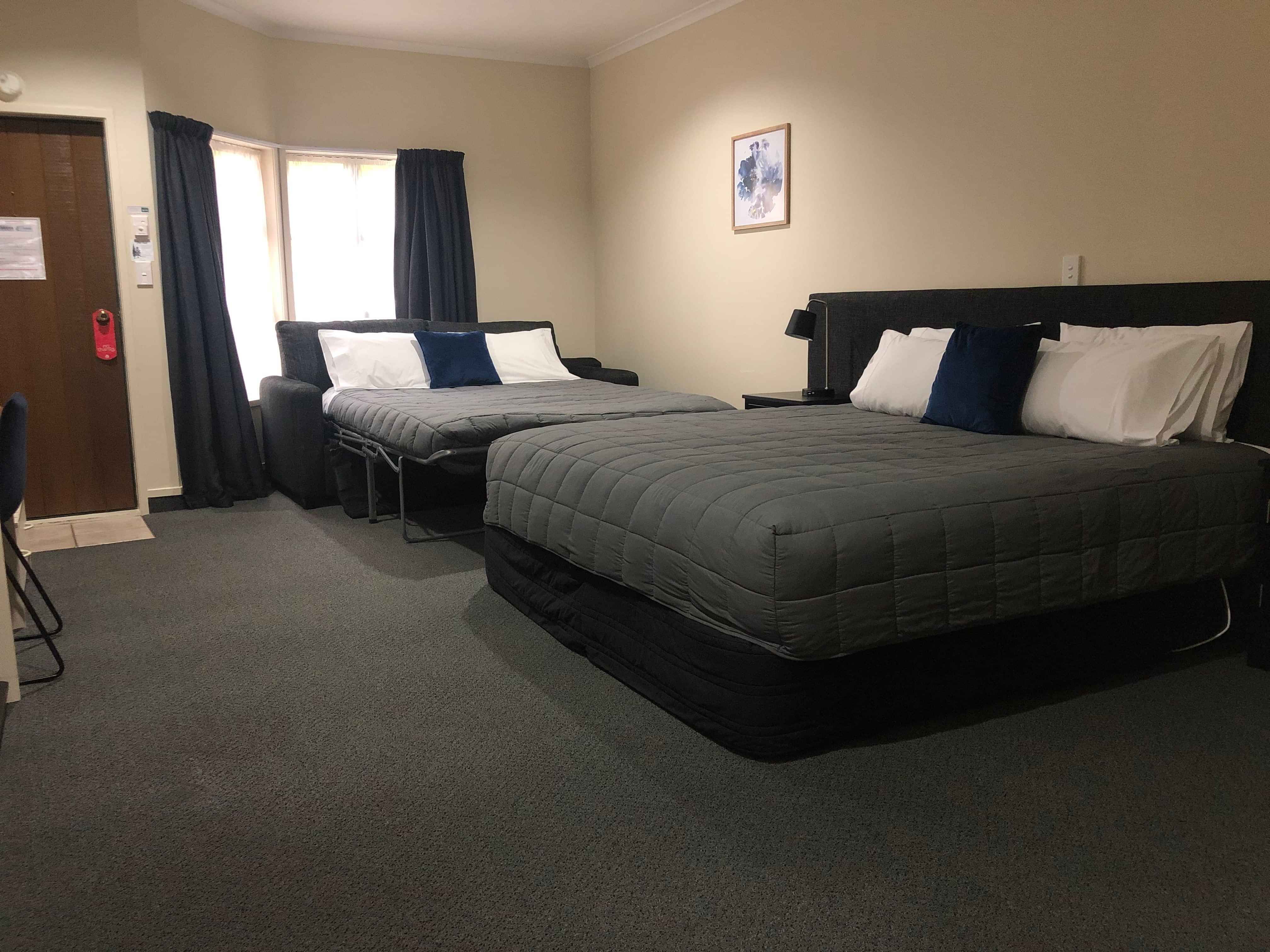 Super King Studio unit at Cambridge Mews showing bed and fold out sofa couch