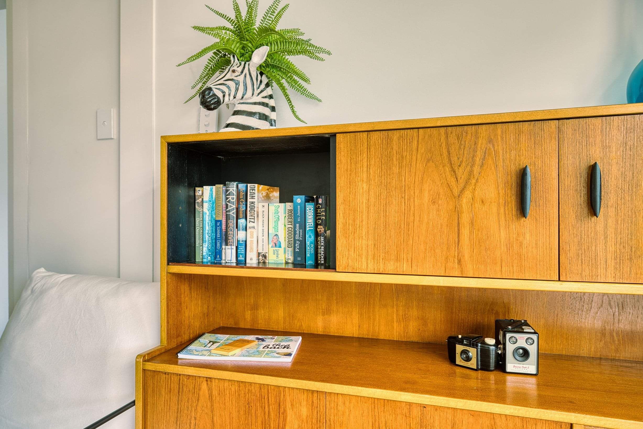 The Bach in Mangawhai - Entertainment and Extras - vintage bookcase with books and games