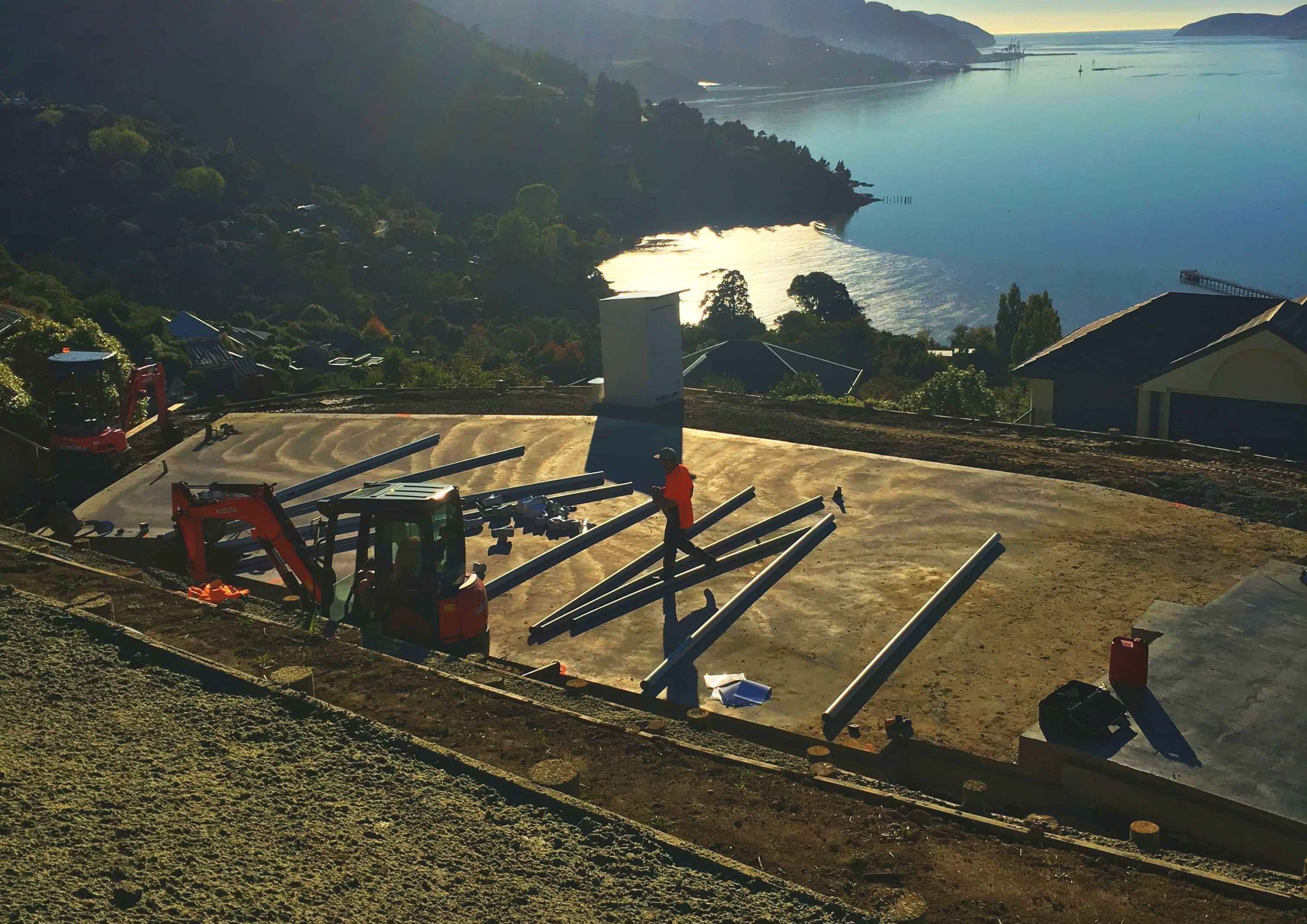 Drainpro prepping site for drainage looking out over harbour