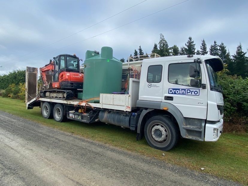 Drainpro truck with digger and septic tank on trailer
