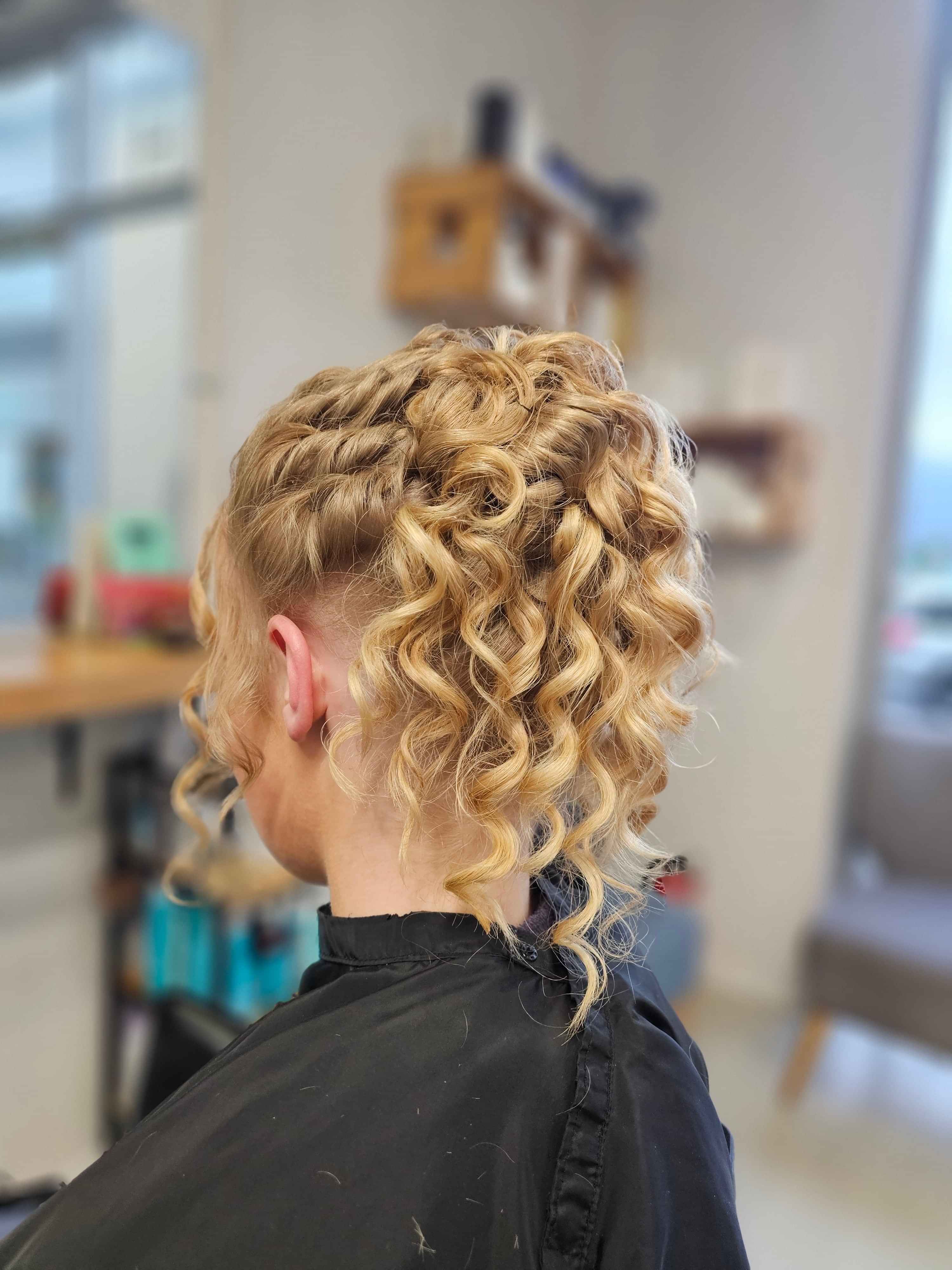 A polaroid style image of an elegant hair up created by Hair by Shiyee.