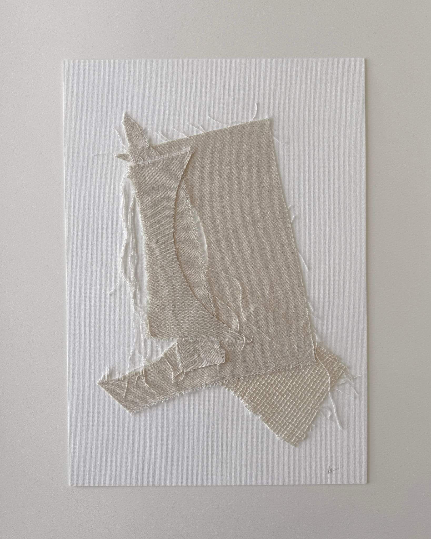 textile collage of neutral fabric on fabriano 