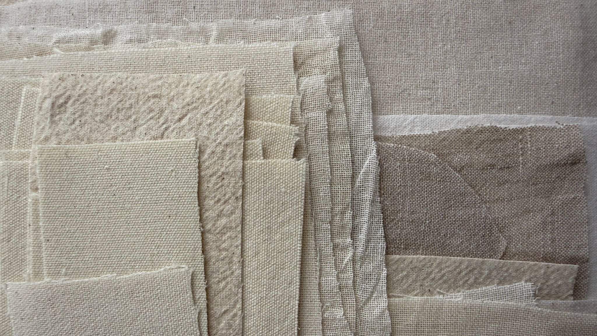 image of layered neutral-toned fragments of repurposed linen and cotton