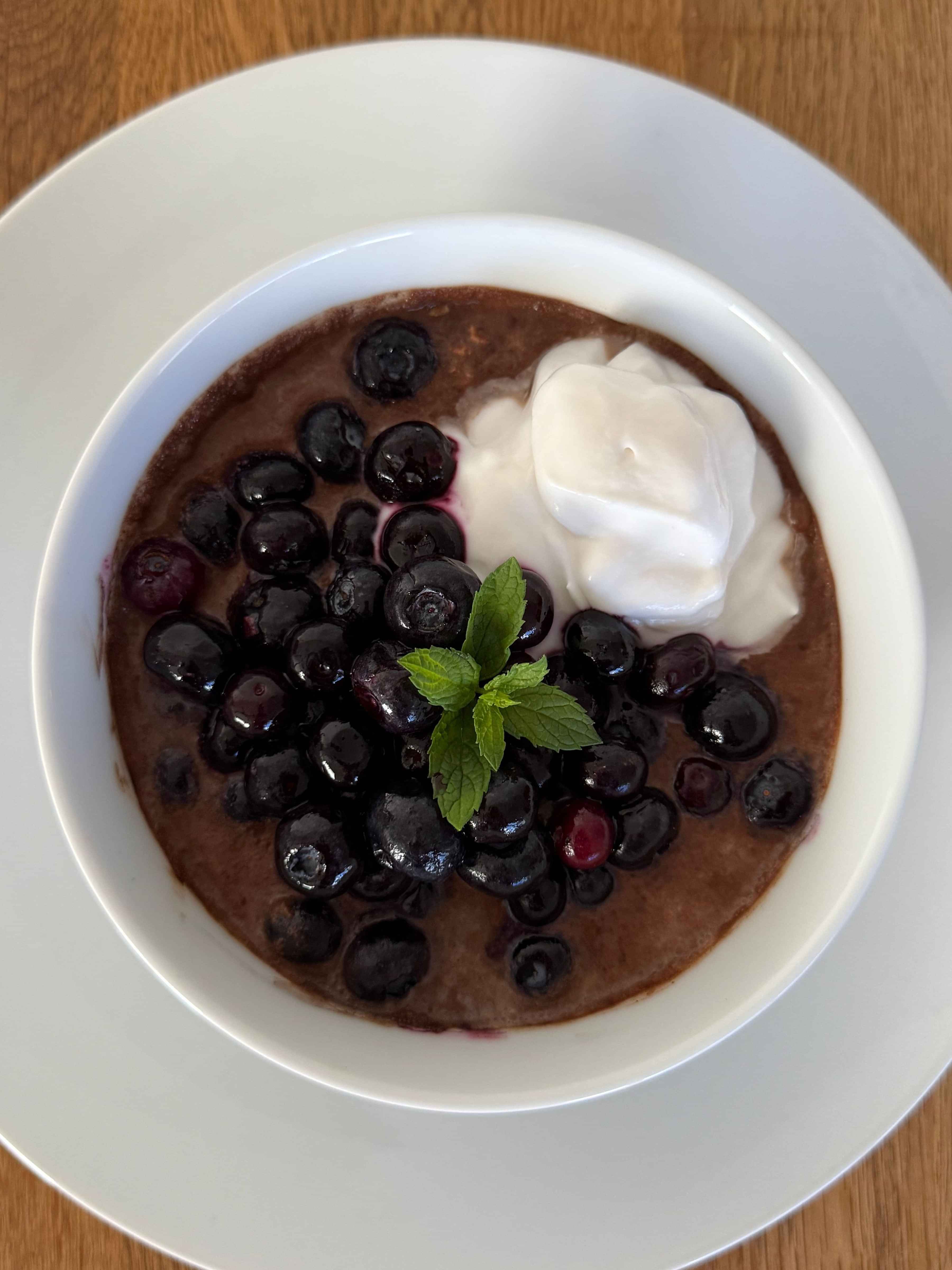 photo of chocolate overnight oats wth berries and yogurt on top