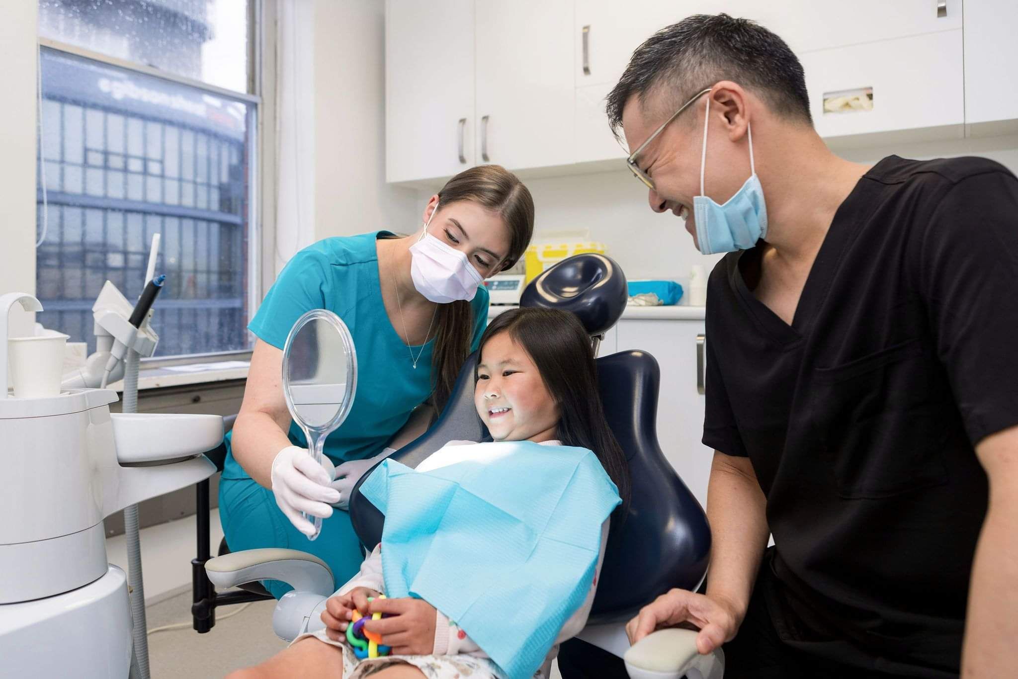 Dentist and Assistant helping with general dental services