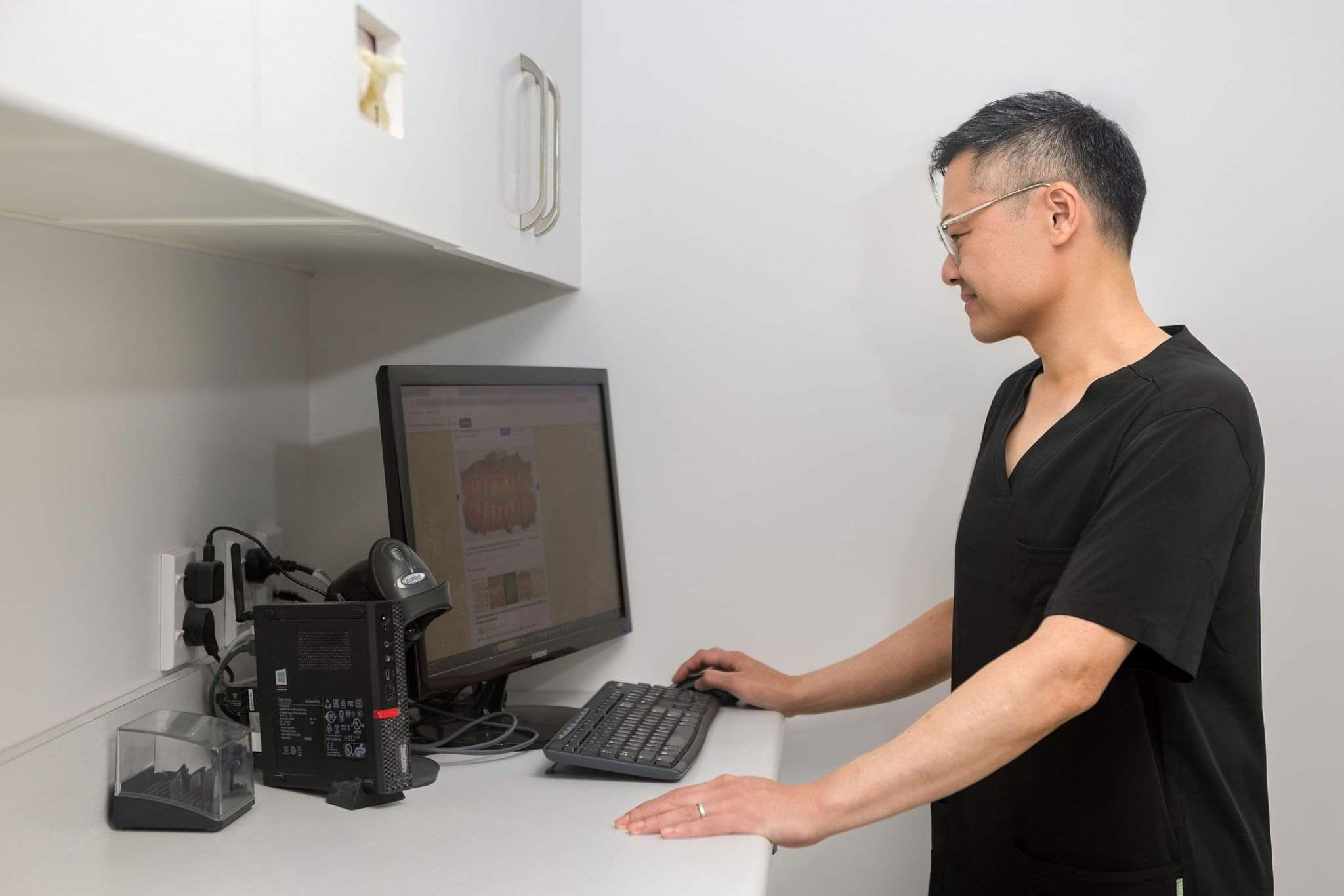 Dentist reviewing scans for crown implant