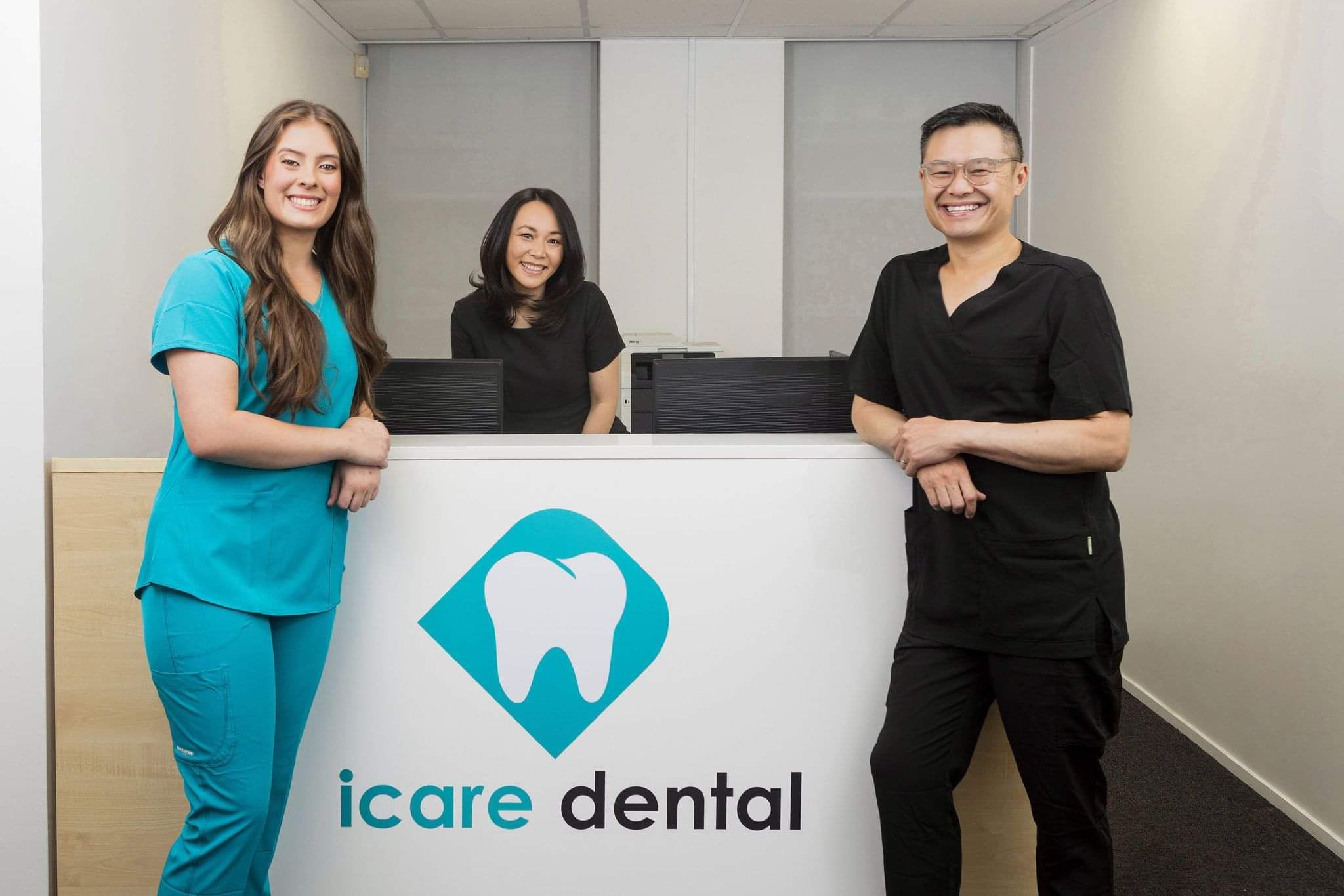 iCare Dental team posing and smiling