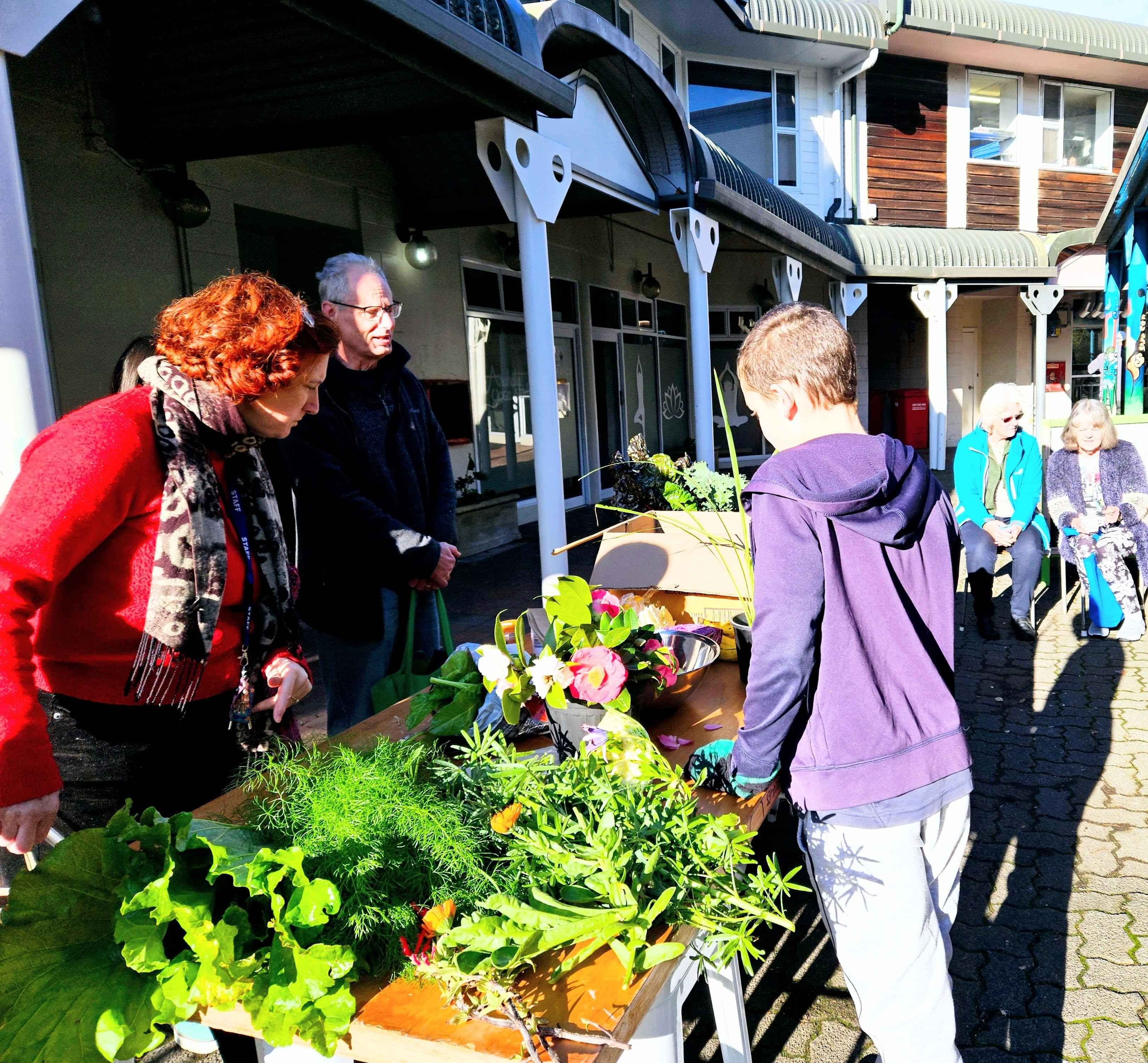 People looking at goodies on the Crop Swap table