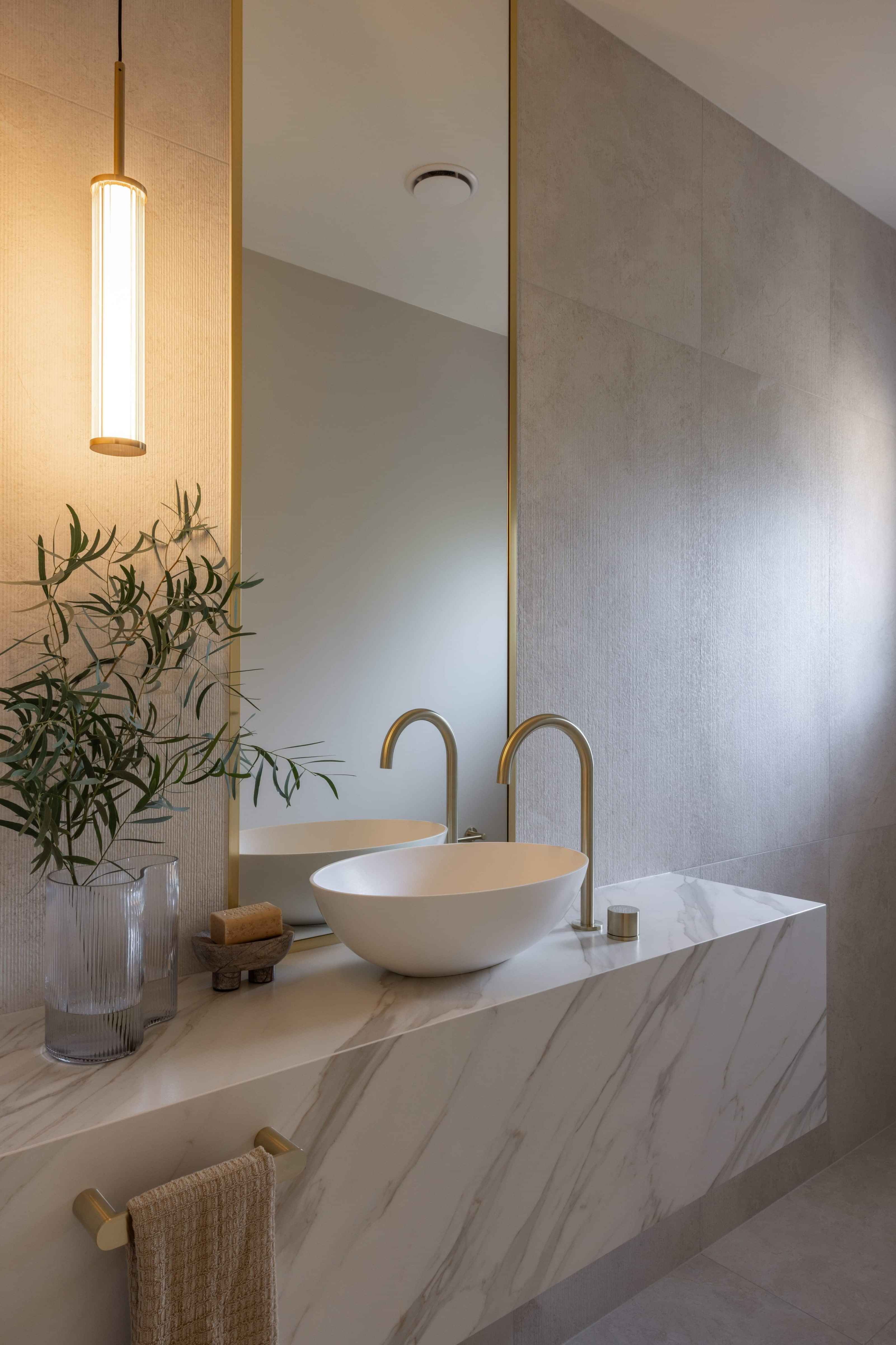 Bathroom renovation with marble vanity, brass tapware and pendant lighting, Epsom, Auckland