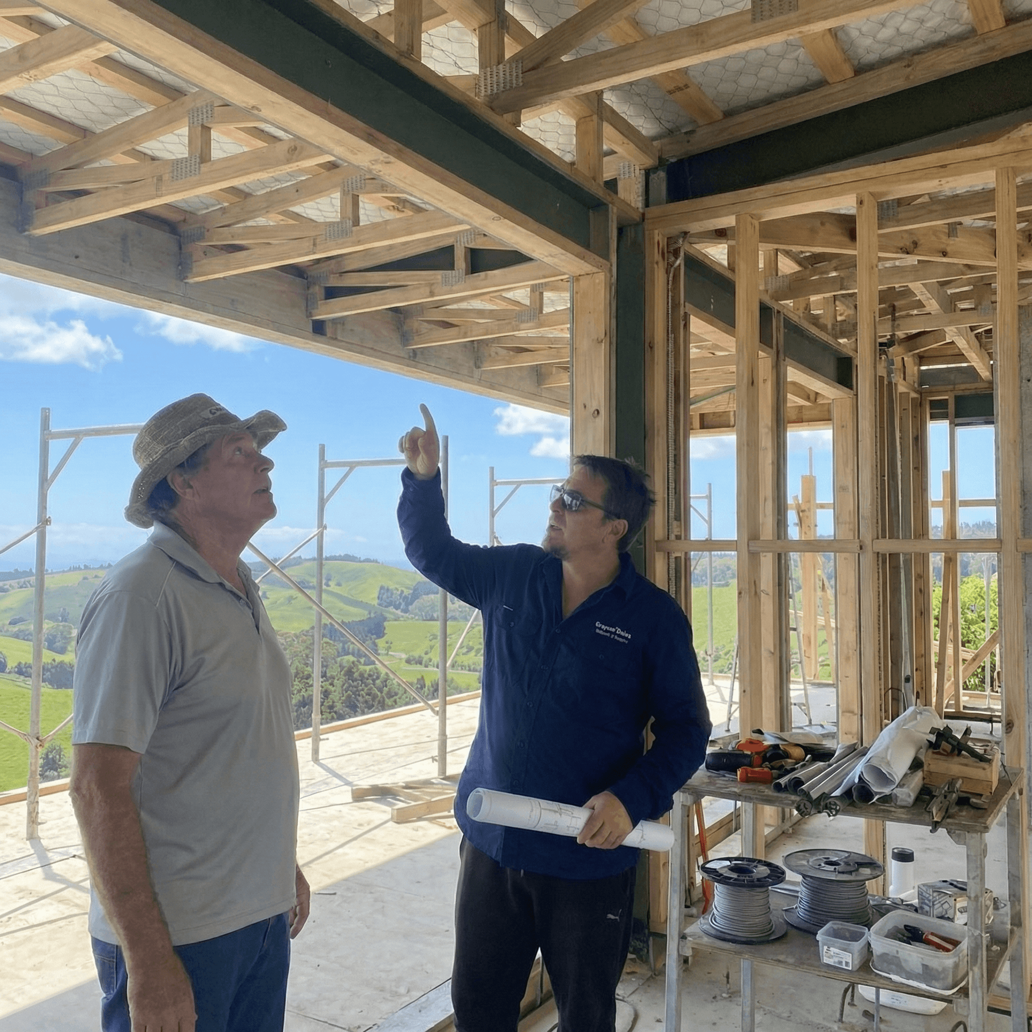 Grayson Dales with a client discussing electrical wiring installation