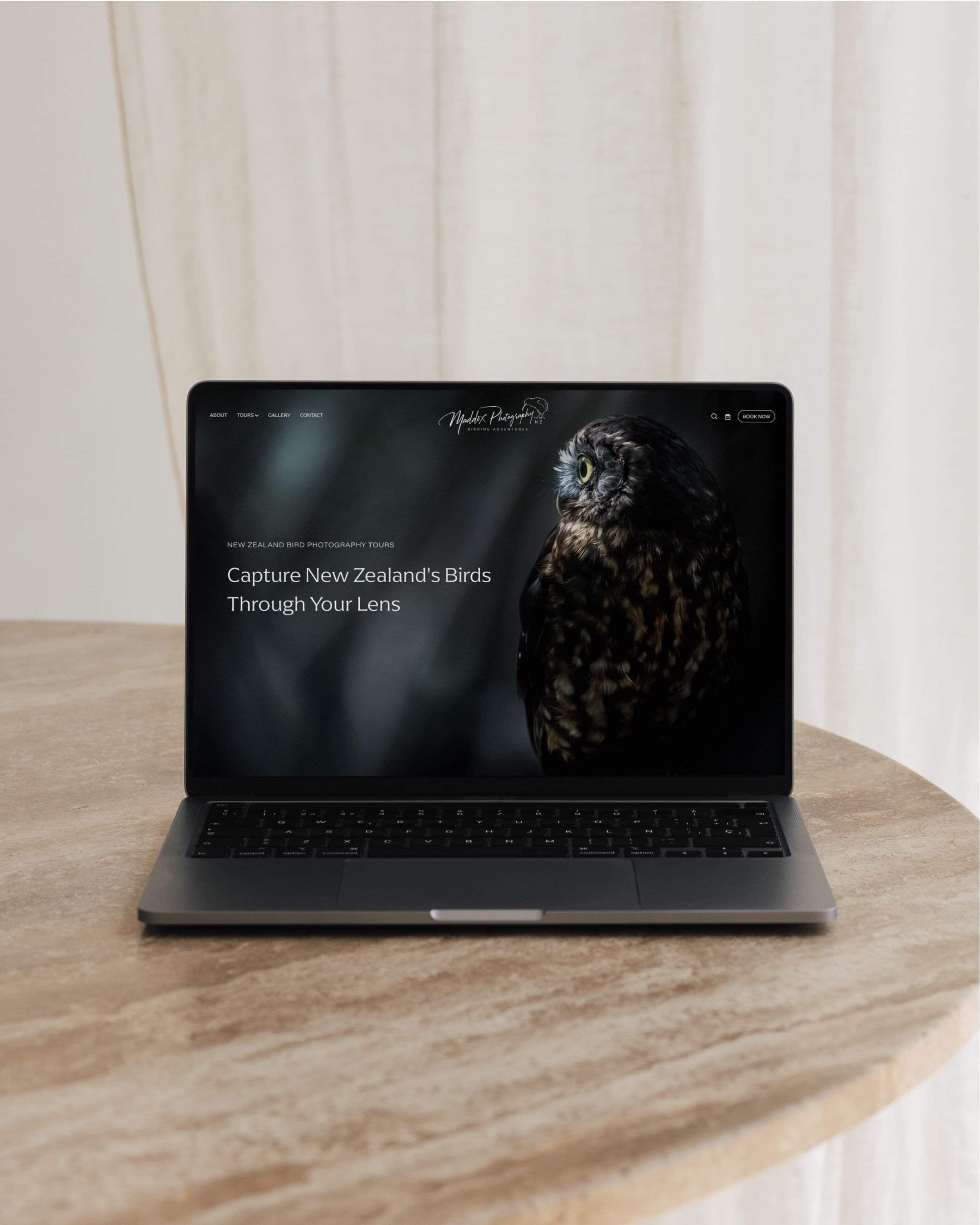 image of laptop and Maddox Photography's website, showcasing NZ native bird photography tours. By Creative Box. Waikato, New Zealand.