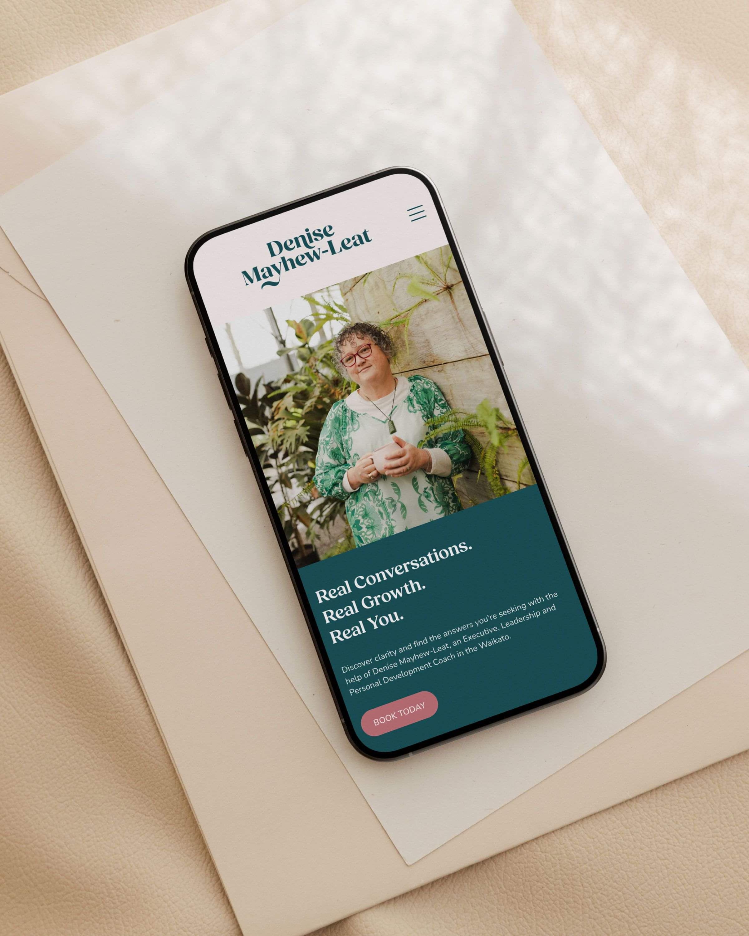 Image of website on iphone designed for Denise Mayhew-Leat, life coach. Creative Box, Waikato, New Zealand.