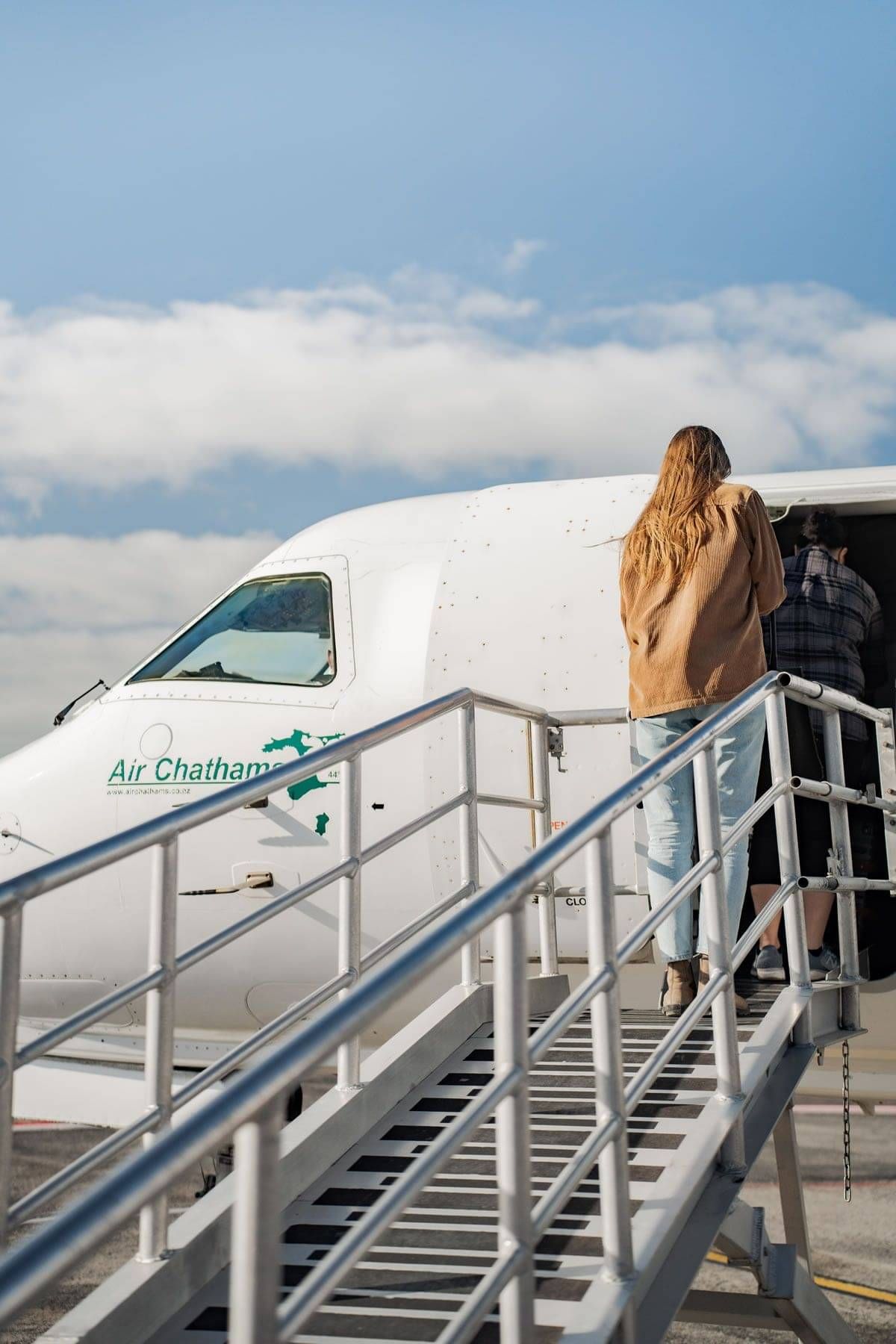 Person getting on plane