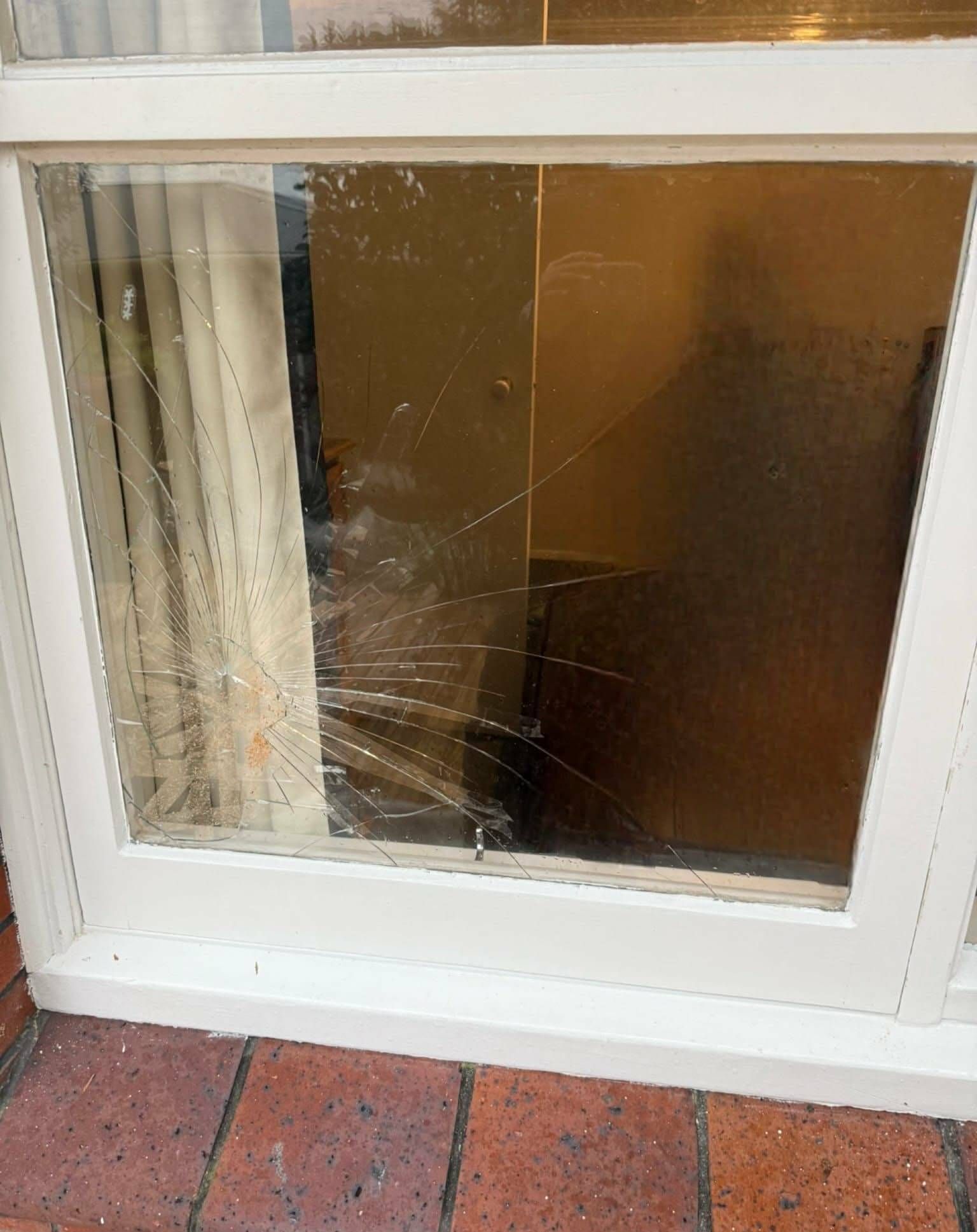 Broken glass window in the corner of the panel