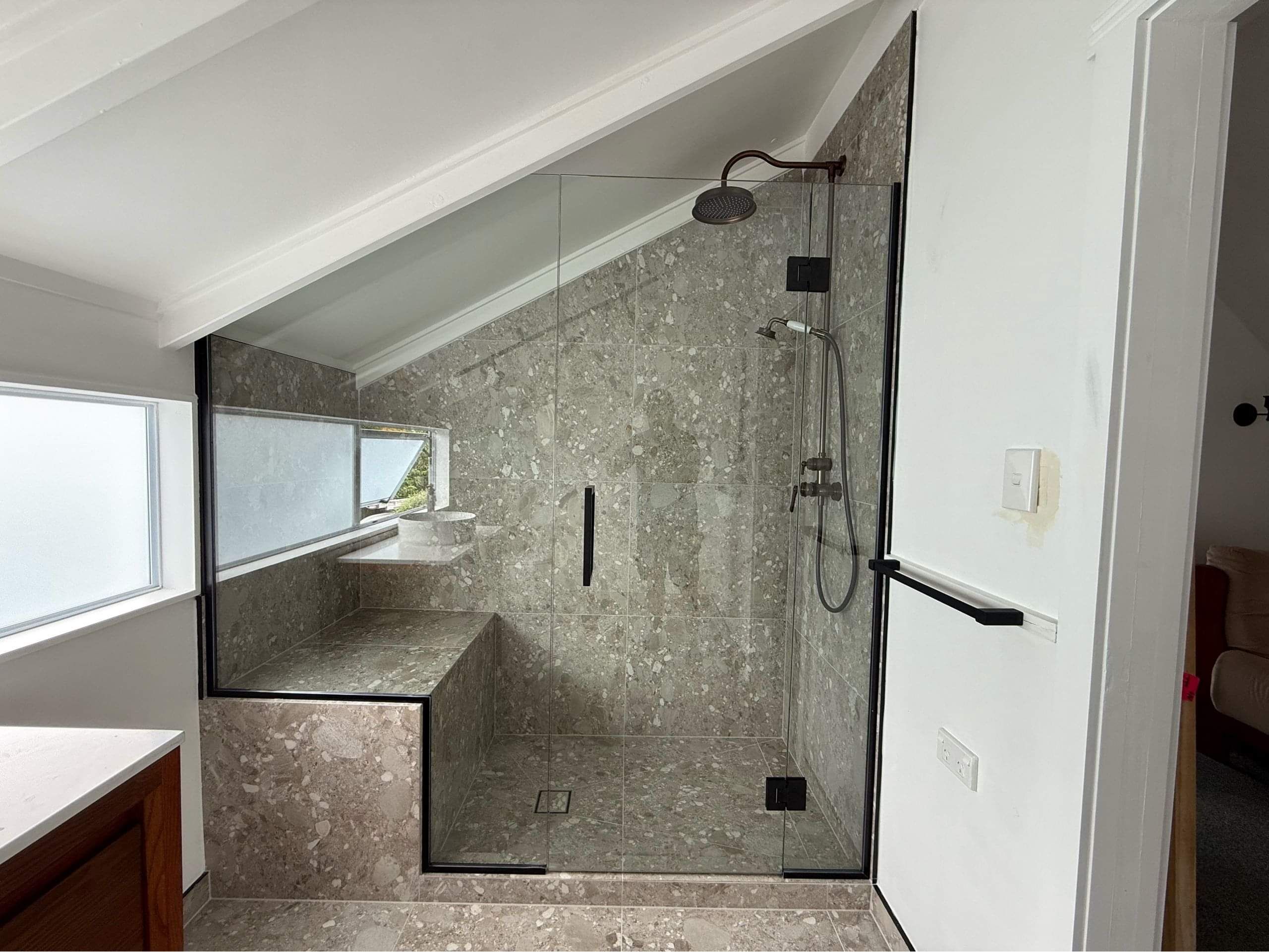 Frameless hinged shower door