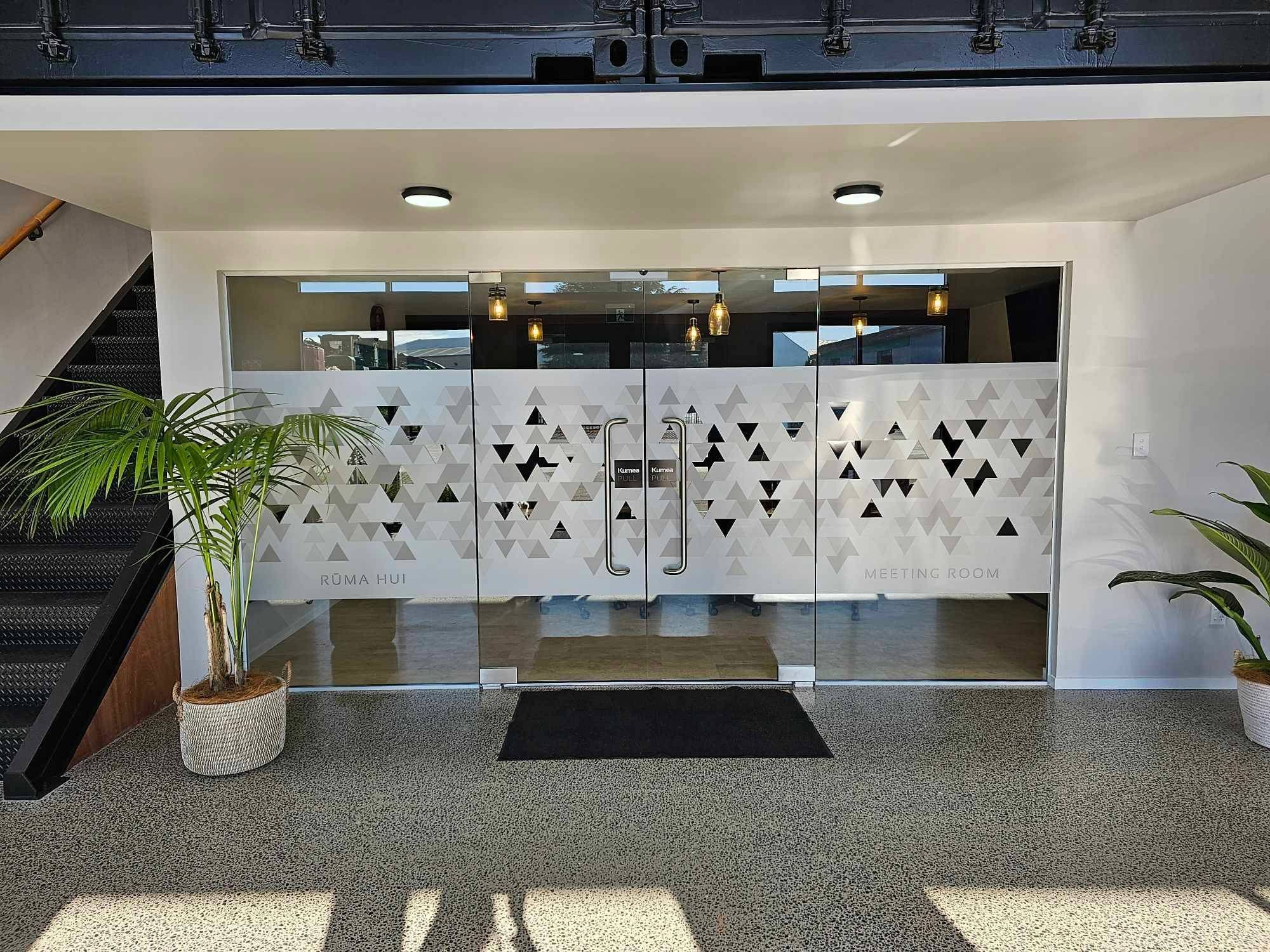 Internal glass partition with manifestation film