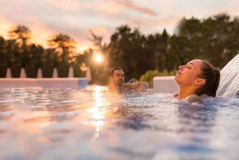 Couple enjoying a soak in the thermal springs at Hanmer Springs