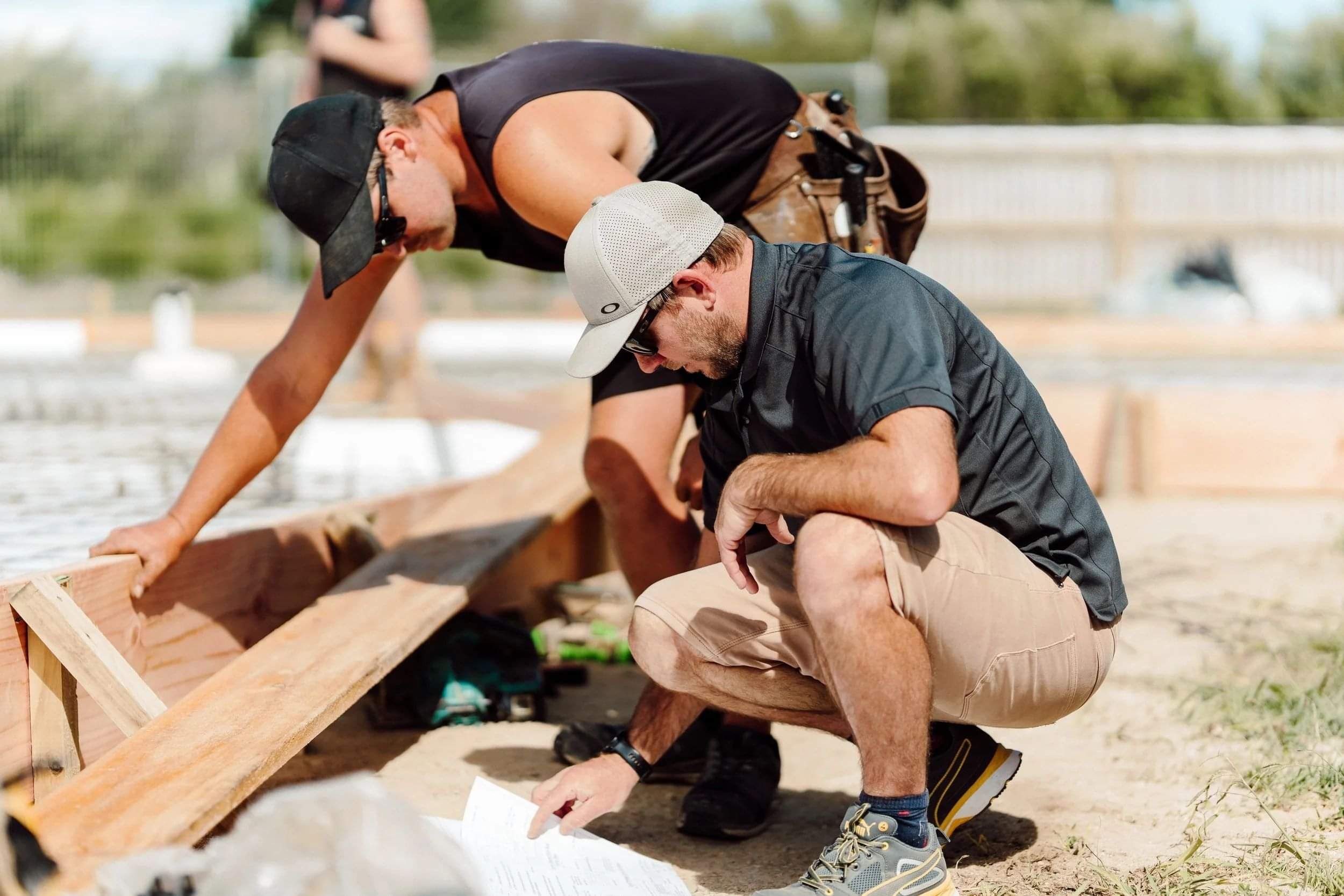 Two builders working on a house build