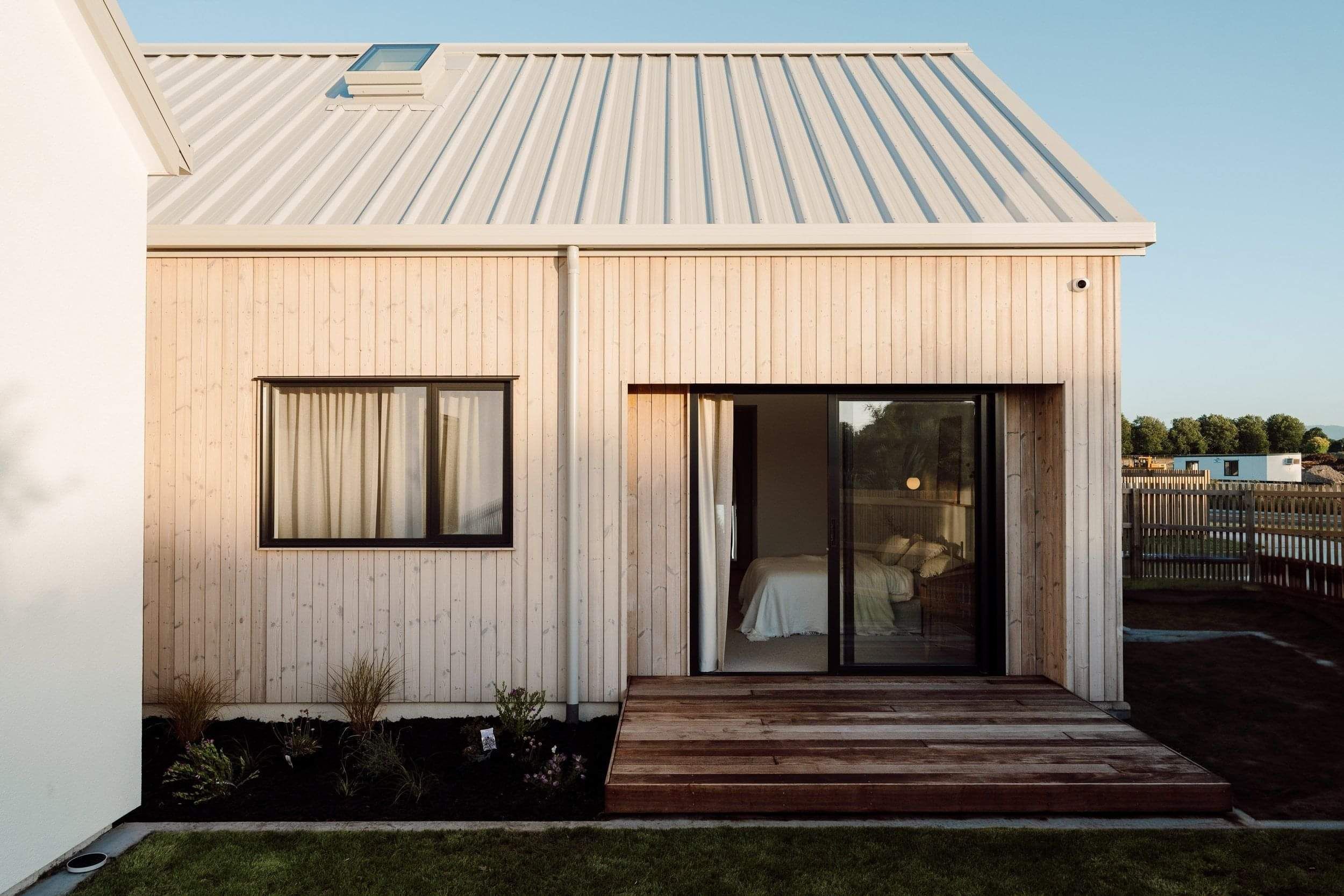 Vertical wooden exterior paneling with ranch slider
