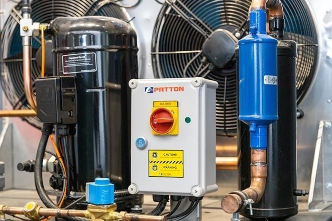 Commercial refrigeration compressor with electrical control panel