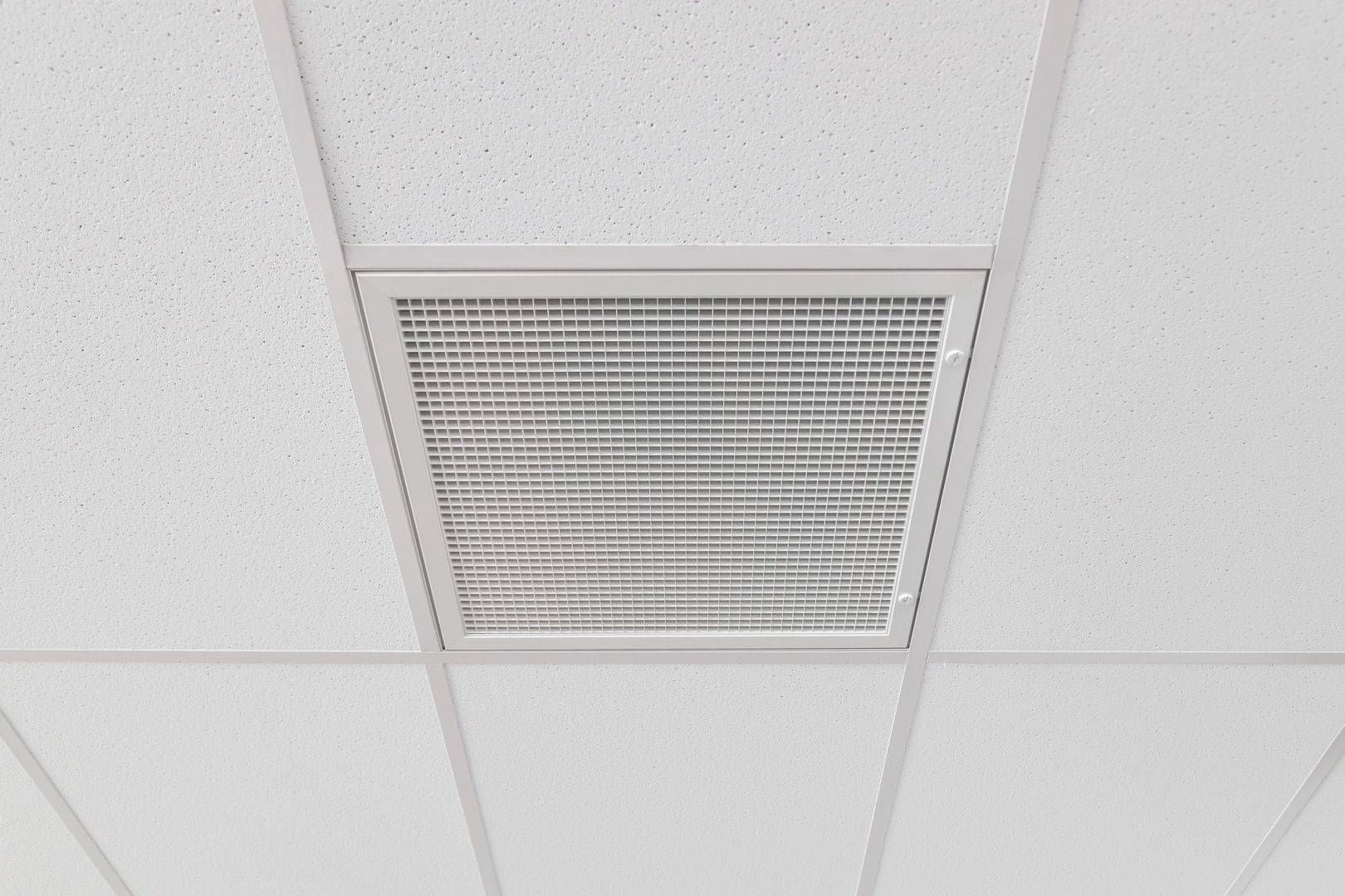 Commercial air conditioning vent installed in an office ceiling