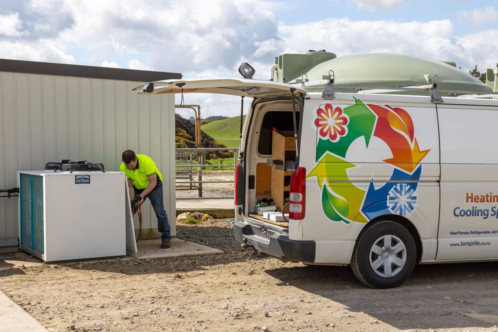 Temprite technician unloading equipment from a service van on site