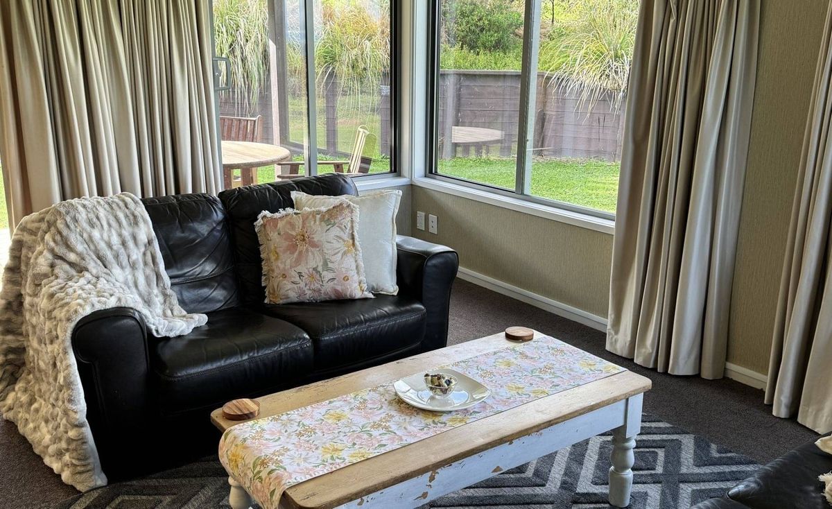 The lounge of the on-site two-bedroom accommodation looking out to the garden