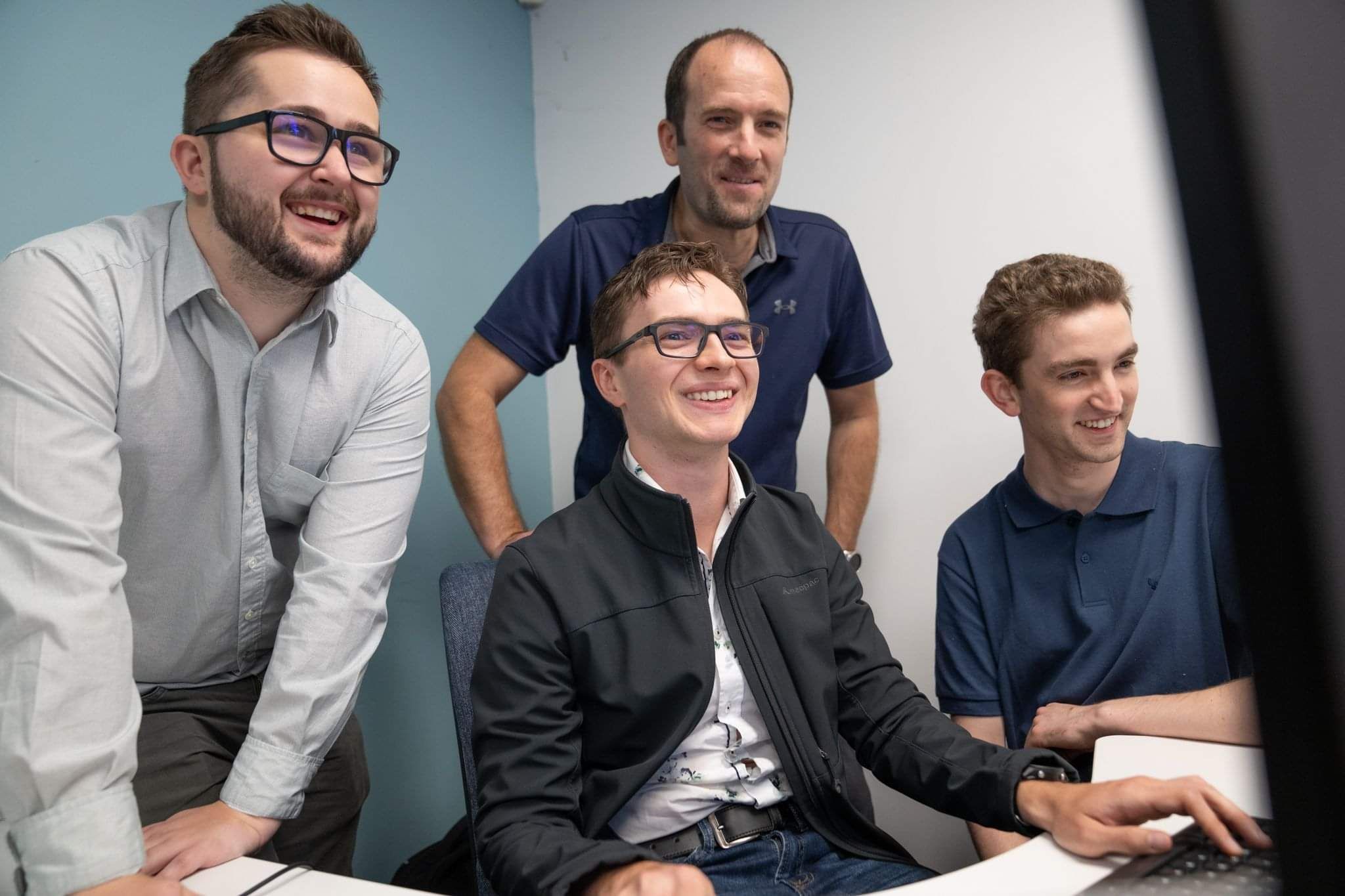 Glassbox software team collaborating at the company's New Zealand office
