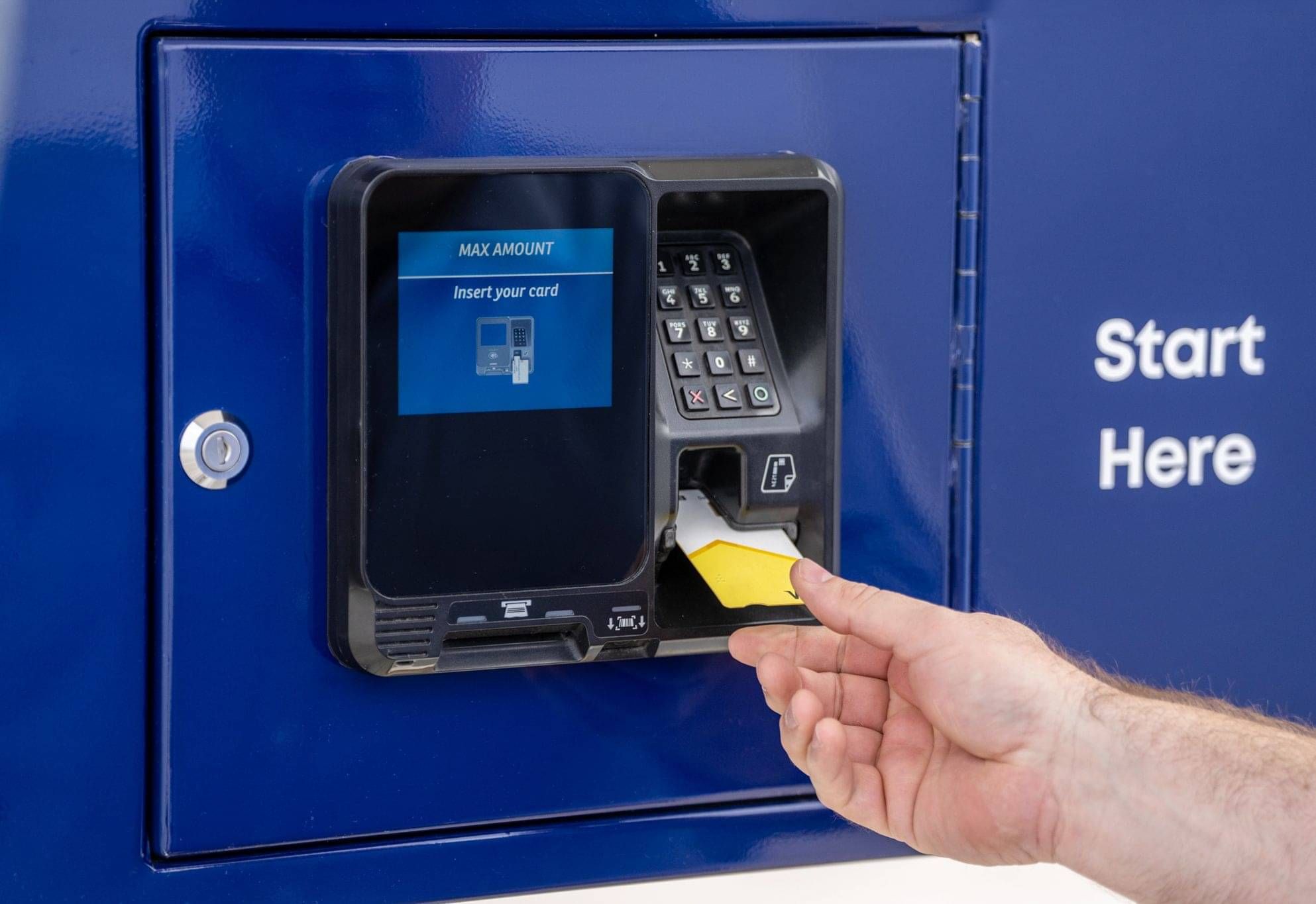 Fuel station payment terminal showing customer paying with a bank card