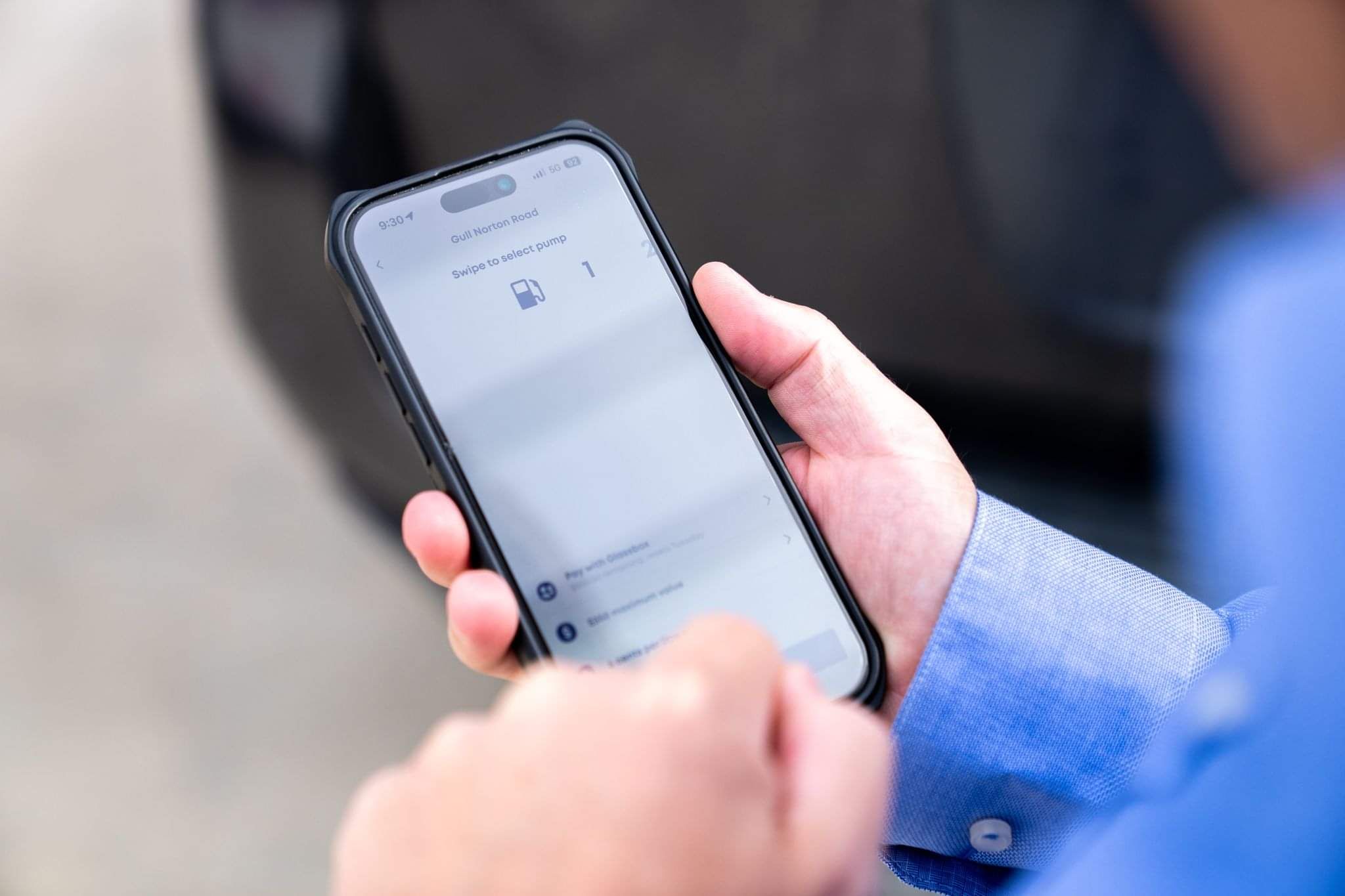 Customer paying for fuel from their mobile phone