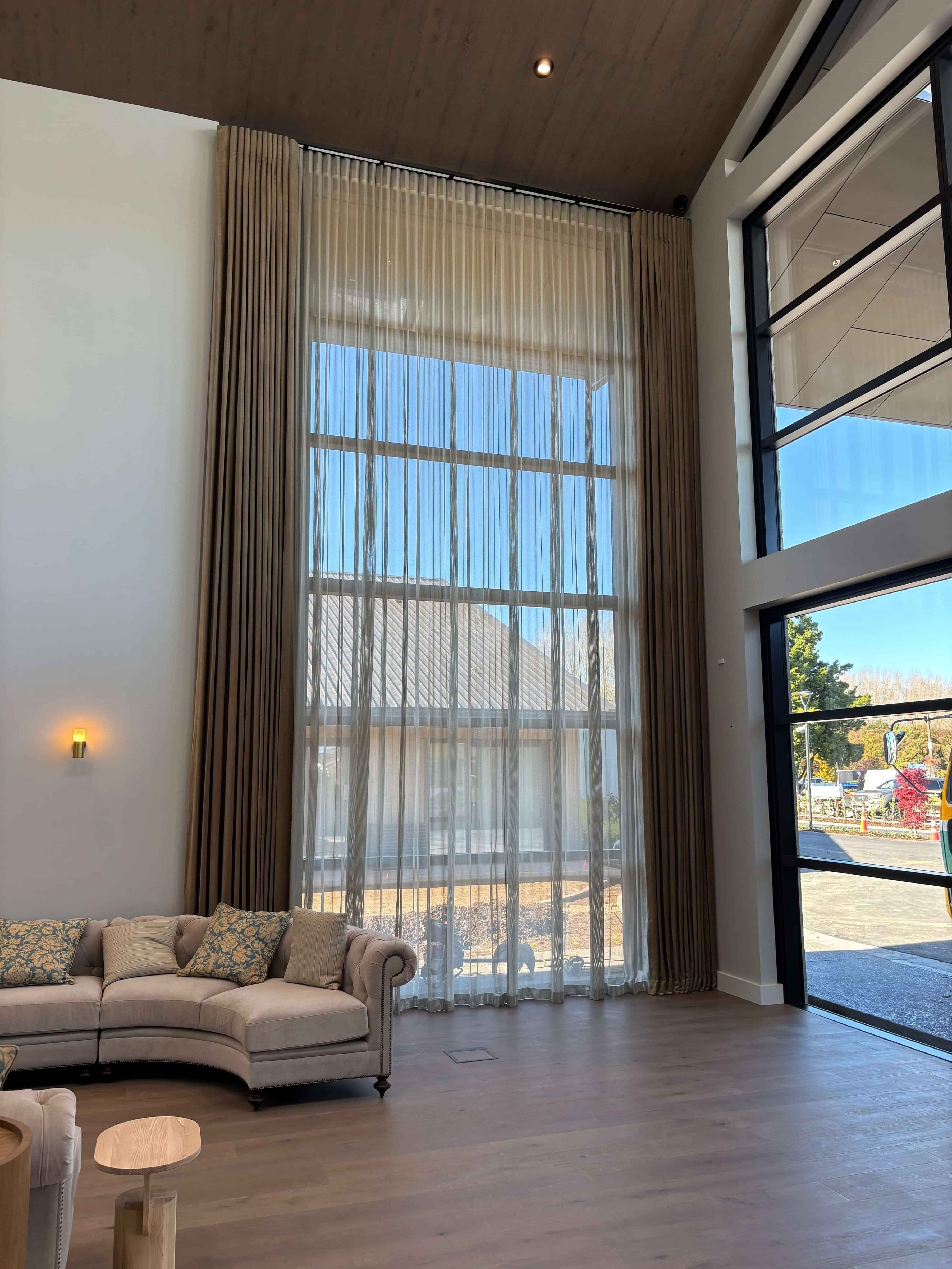 Floor-to-ceiling drapery in a commercial interior