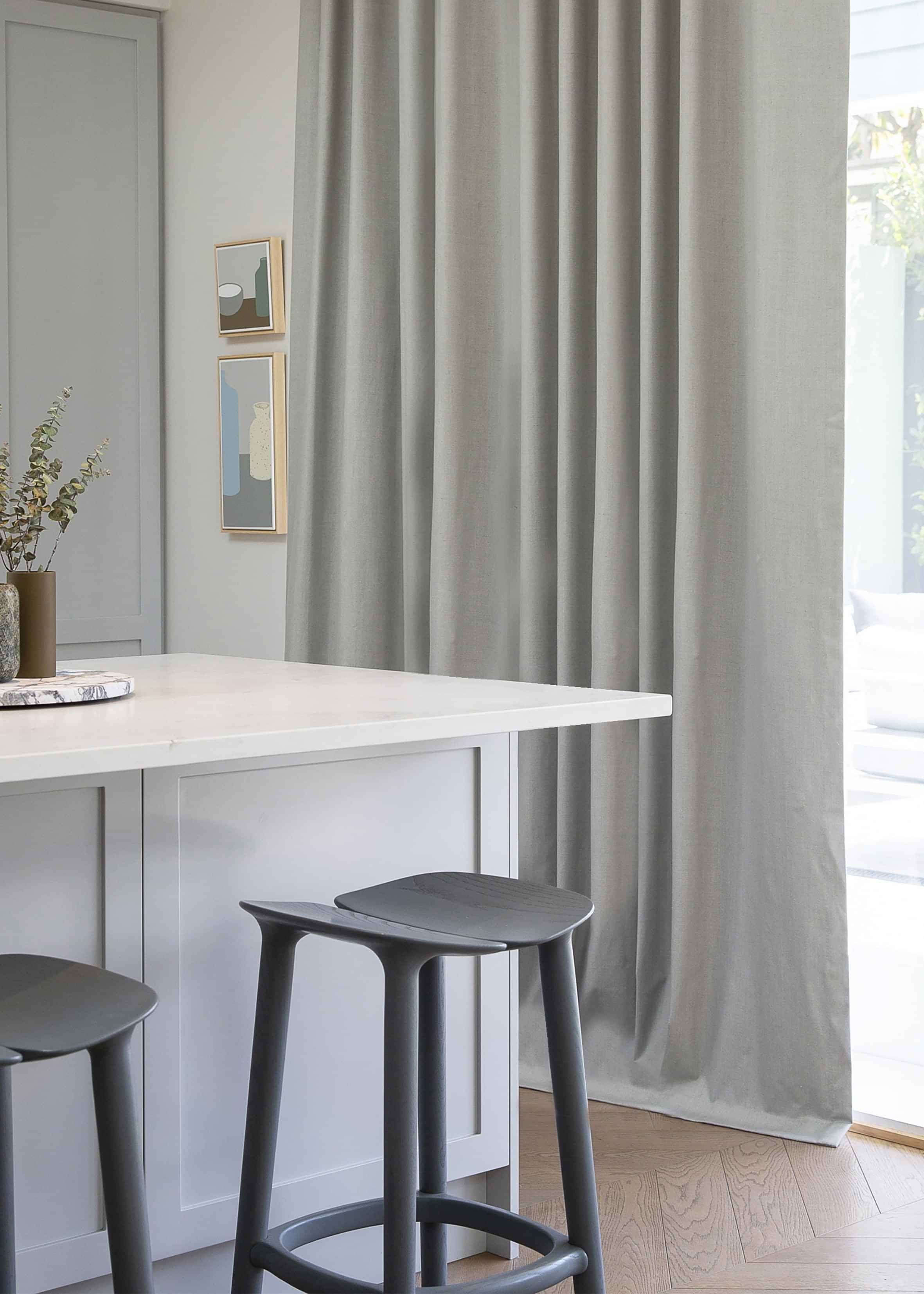Floor-length drapery framing a large window