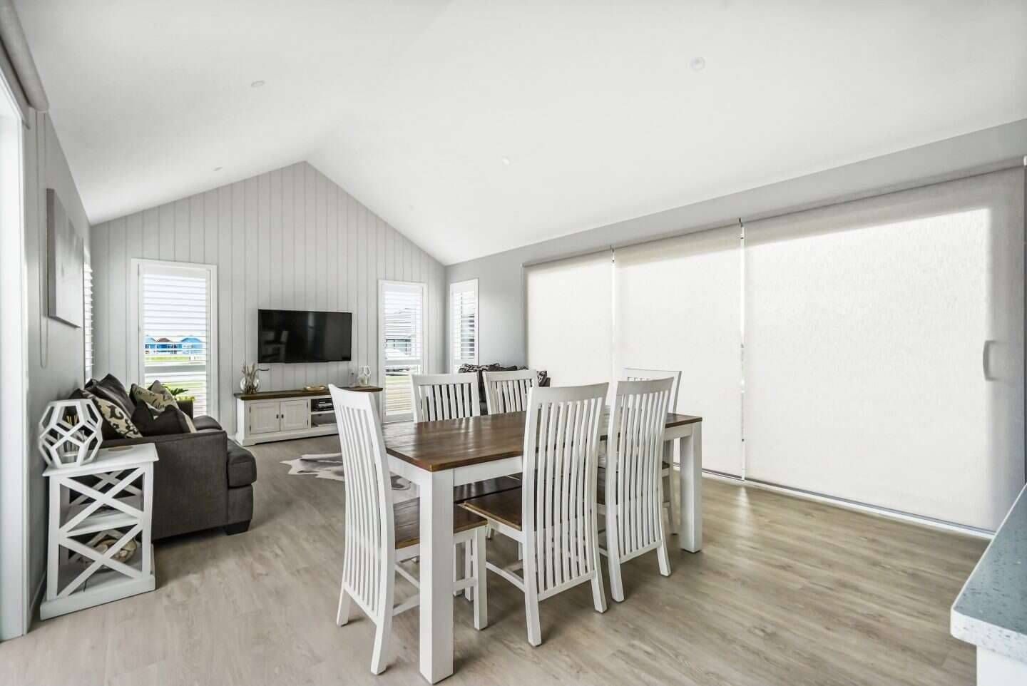 Custom roller blind in a modern dining room