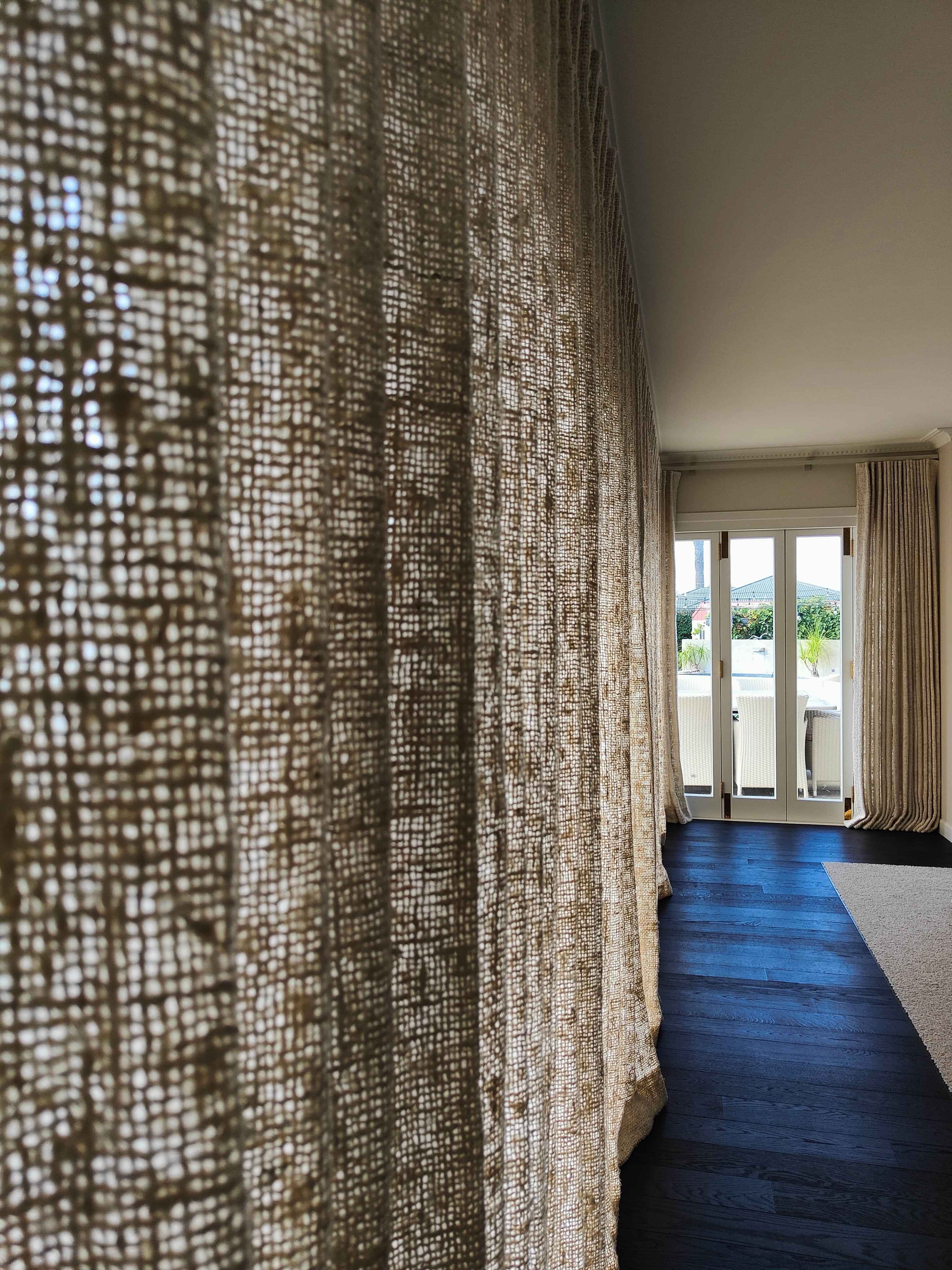 Textured James Dunlop Rustic curtains creating a warm, elegant interior