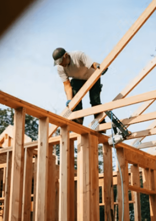 Builder working on timber framing
