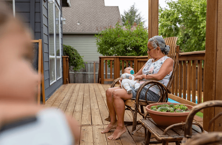 Family spending time together on a deck