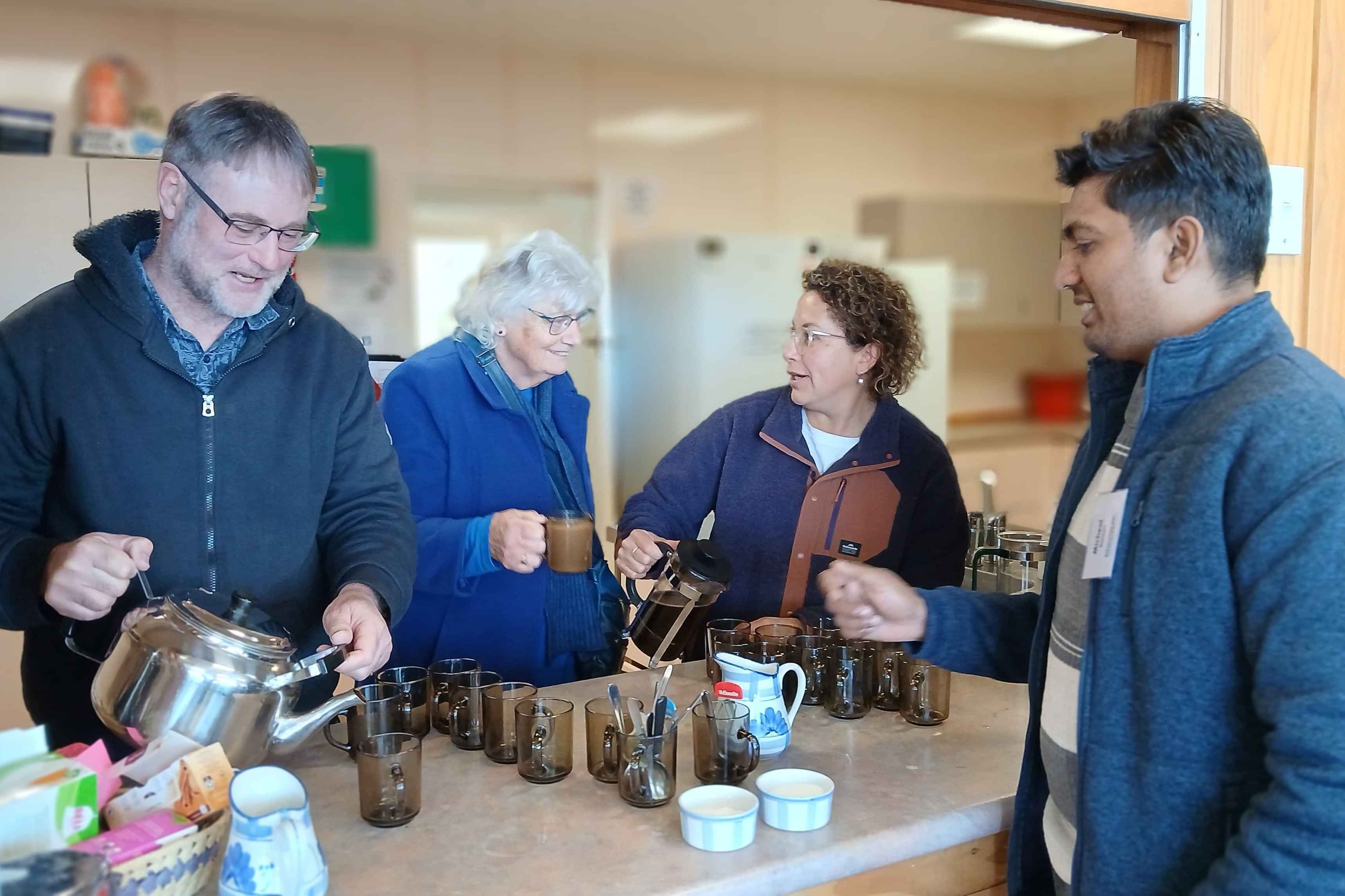 Image of people serving morning tea