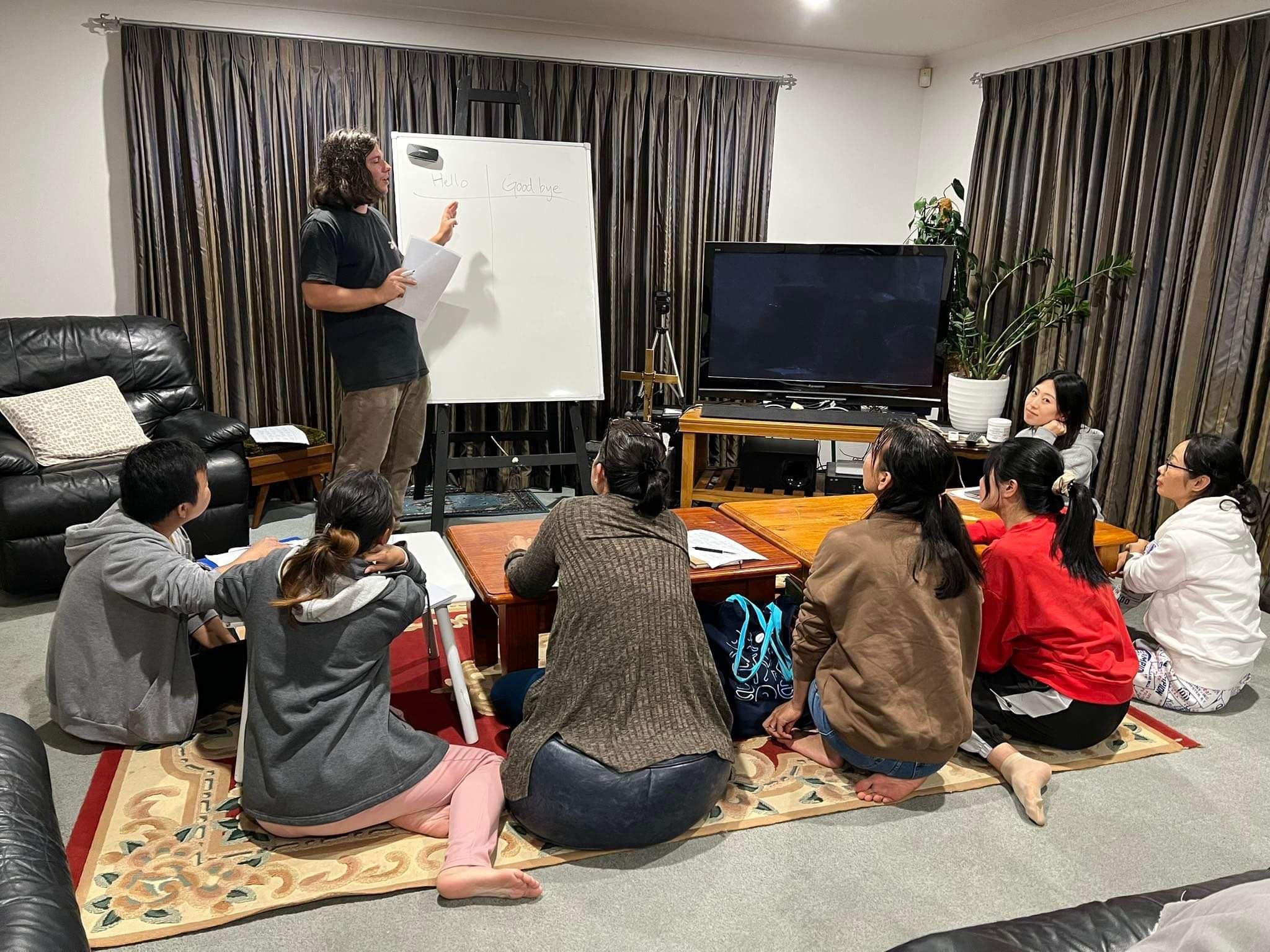 Image of teacher helping English as a second language students