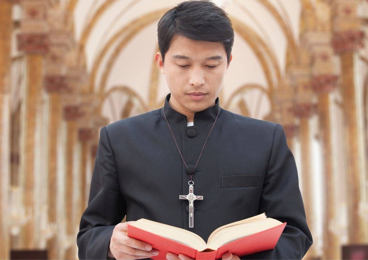 Religious worker reading from a book inside a church